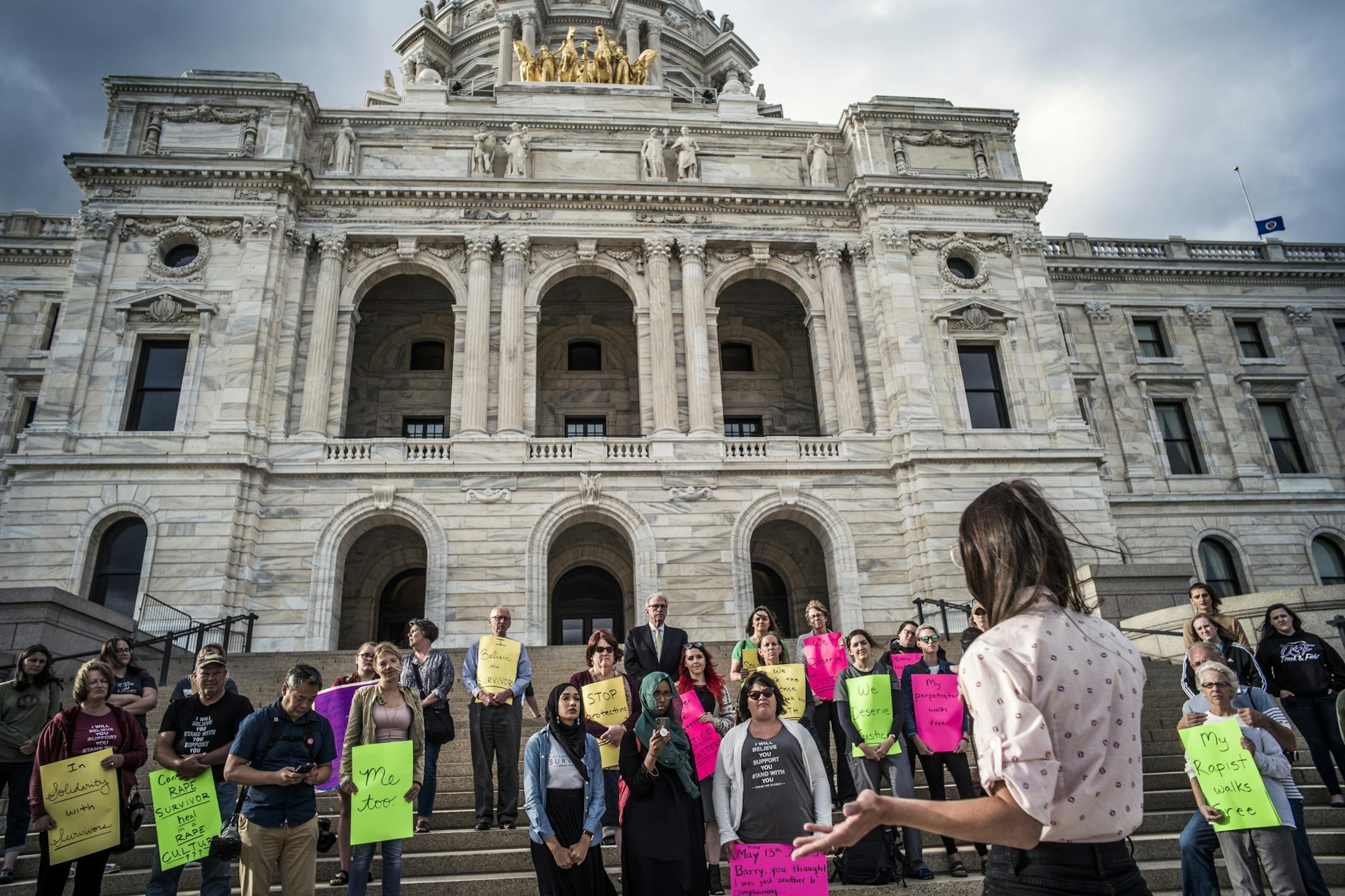 Several dozens survivors of sexual assault and their allies gathered on the steps of the State Capitol to draw attention to unsolved rape cases.
