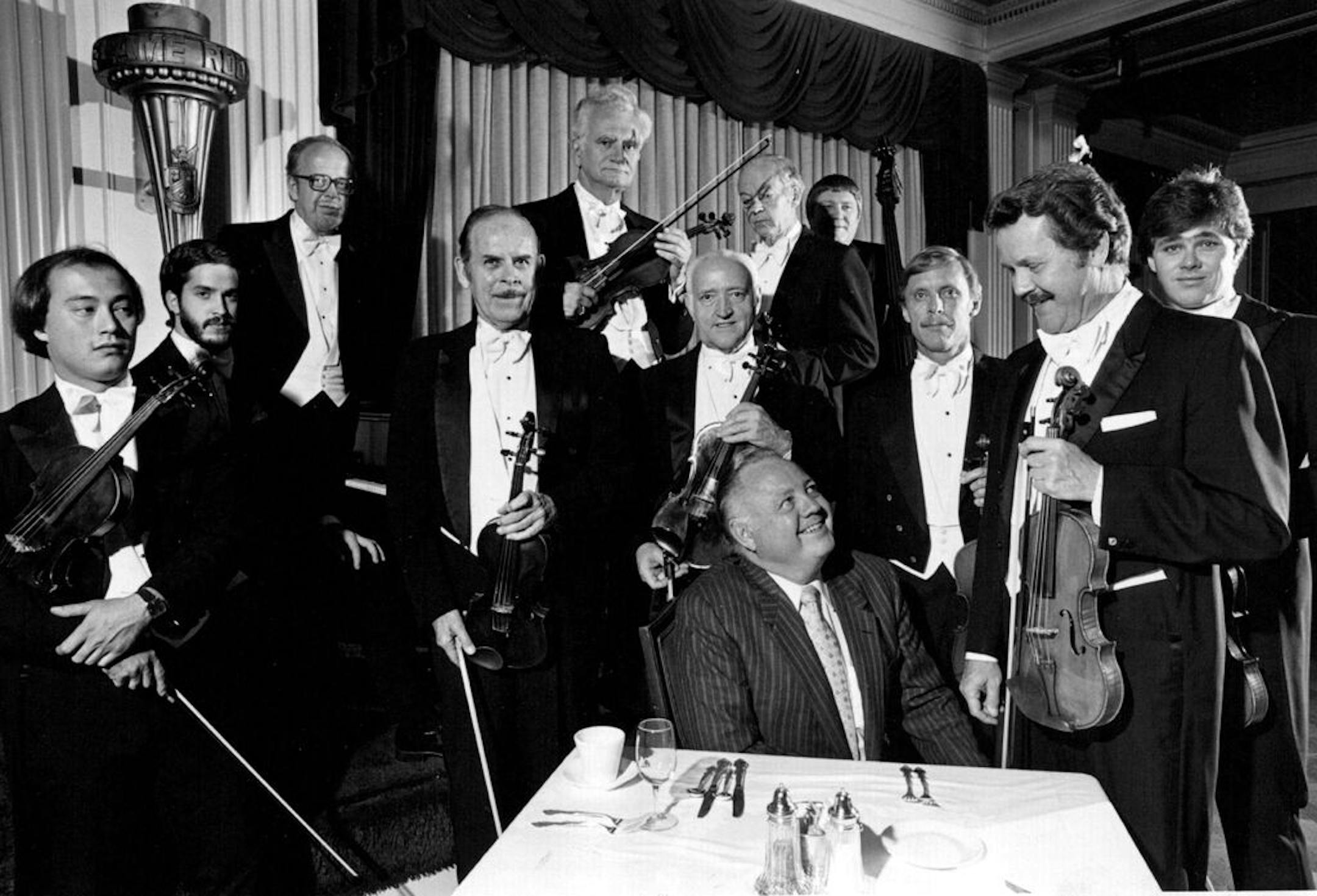 October 8, 1981 Last performance of the Golden Strings to be Nov. 20 -- The Golden Strings have played for more than two million diners in 13 years at the Flame Room of the downtown Radisson Hotel. They have six weeks left to play. Wednesday they gathered for a picture with Curt Carlson, chairman of Carlson Companies, who was responsible for the formation of the group In early 1963. Carlson was looking at Clifford Brunzell, who has been lead violinist since the group was formed in early 1963. Th
