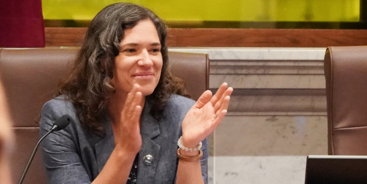 Minneapolis City Council members Jeremiah Ellison and Lisa Bender applauded after Andrew Fahlstrom, center, led renters and members of their advocacy groups in singing the song Solid Like a Rock as council members entered the chambers. ] GLEN STUBBE • glen.stubbe@startribune.com Wednesday, August 28, 2019 Renters and their advocacy groups squared off against landlords and their associations over two controversial proposed Minneapolis ordinances that would limit how tenant screenings including cr