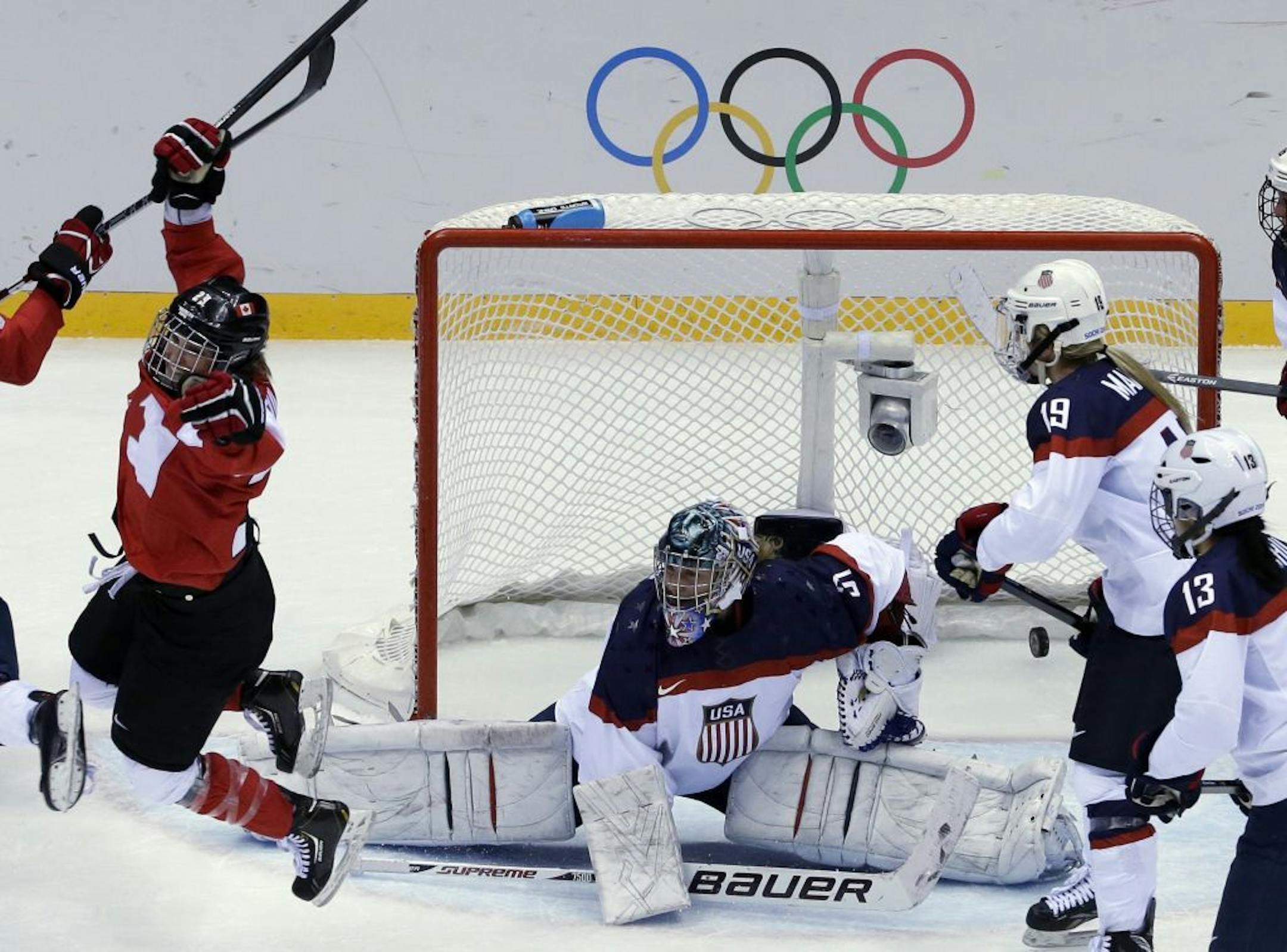 Marie-Philip Poulin of Canada (29) reacts after scoring past USA goalkeeper Jessie Vetter (31) of the women's gold medal ice hockey game at the 2014 Winter Olympics, Thursday, Feb. 20, 2014, in Sochi, Russia.