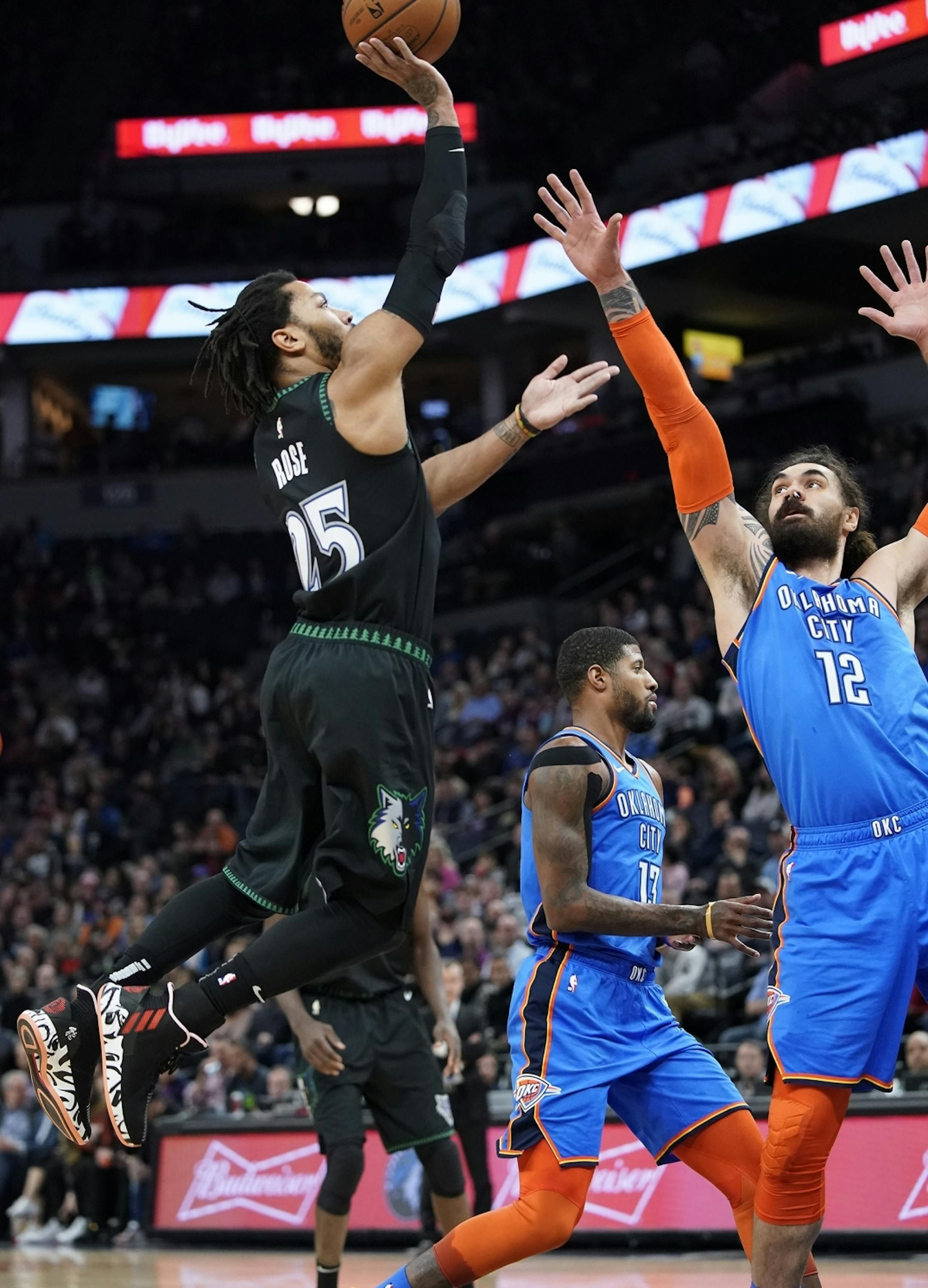 Minnesota Timberwolves guard Derrick Rose (25) shoots as Oklahoma City Thunder center Steven Adams (12) defends during the first half.