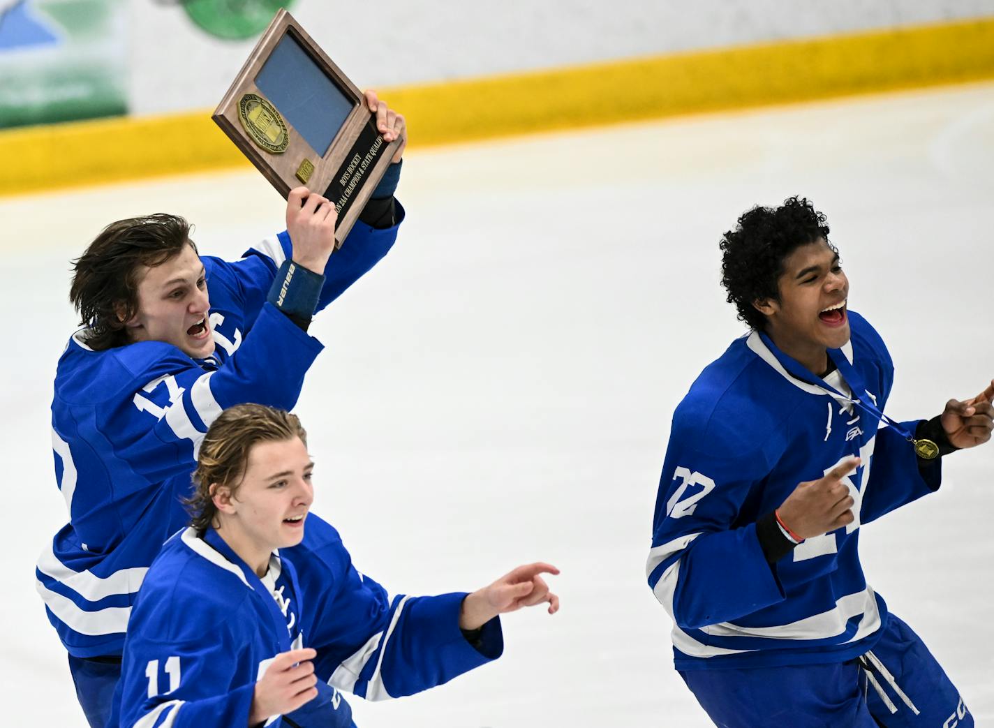 Minnetonka forward Ashton Schultz (11), defenseman Liam Hupka (17) and forward Javon Moore (22) celebrate their 2-1 double overtime victory against Chanhassen in the Class 2 Section 2 boys hockey section final Thursday, March 2, 2023 at the Braemar Ice Arena in Edina, Minn.. ] AARON LAVINSKY • aaron.lavinsky@startribune.com