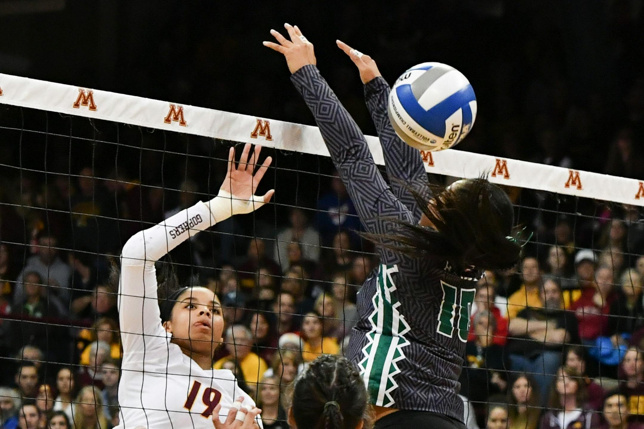 Gopher 19 Alexis Hart gets one past Hawaii 10 Norene Iosia in the first game.