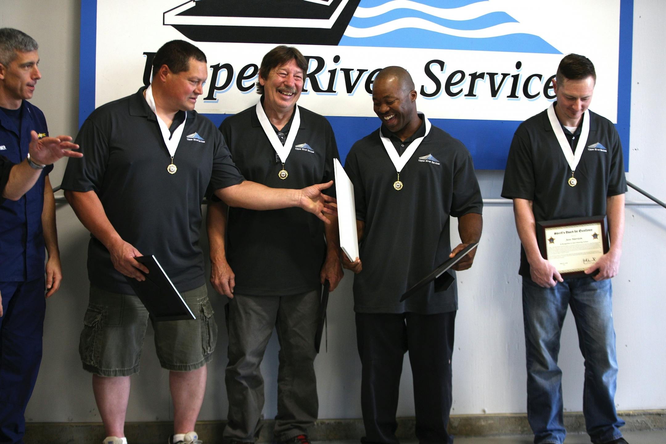 (From left) Russ Galvan, Randy Kohl and Beasley Baker shared a laugh as Jesse Harrison stood to the side softly smiling.
