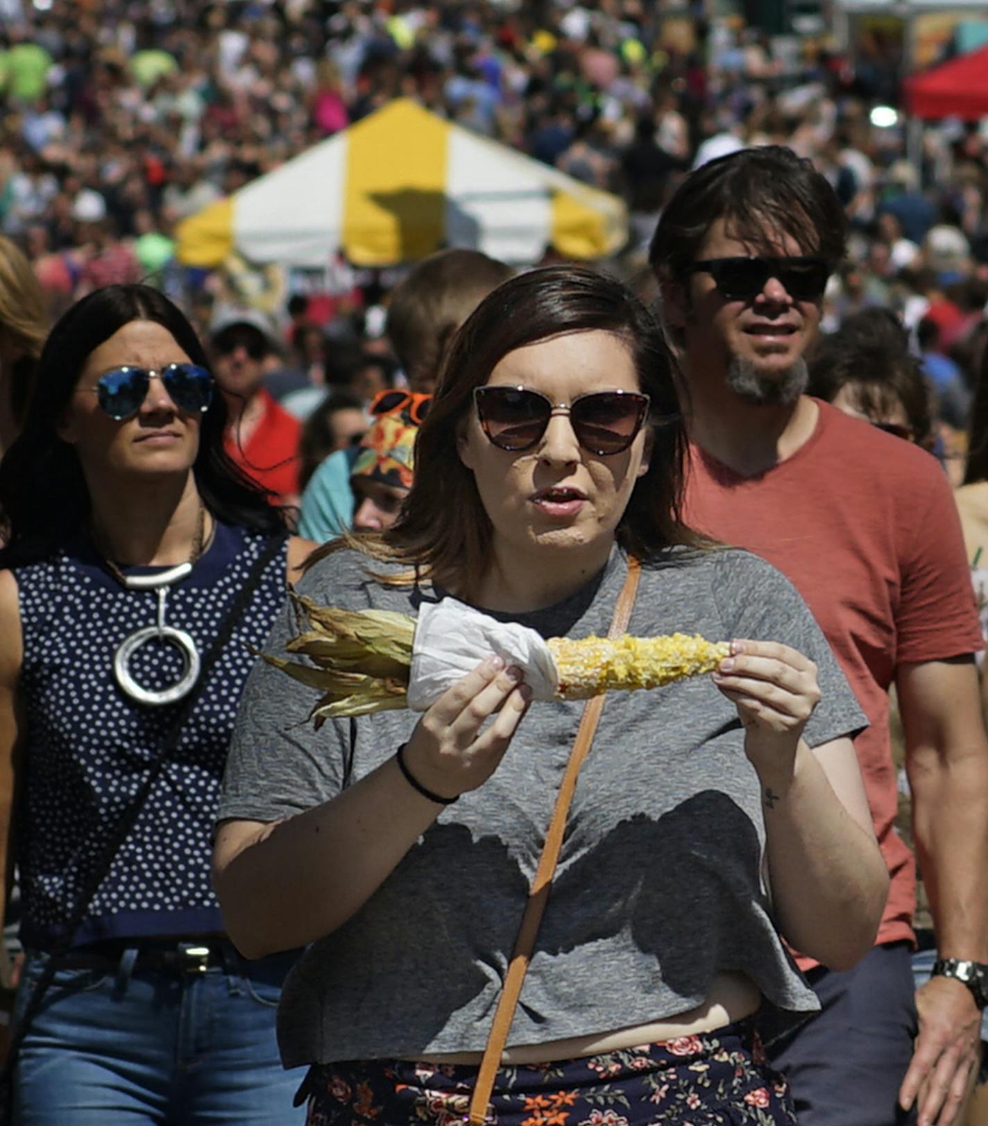 Summer is here with walking food as corn on the cob.[At Grand Old Days in St. Paul, conditions were ideal for the street festival. Richard Tsong-Taatarii/rtsong-taatarii@startribune.com