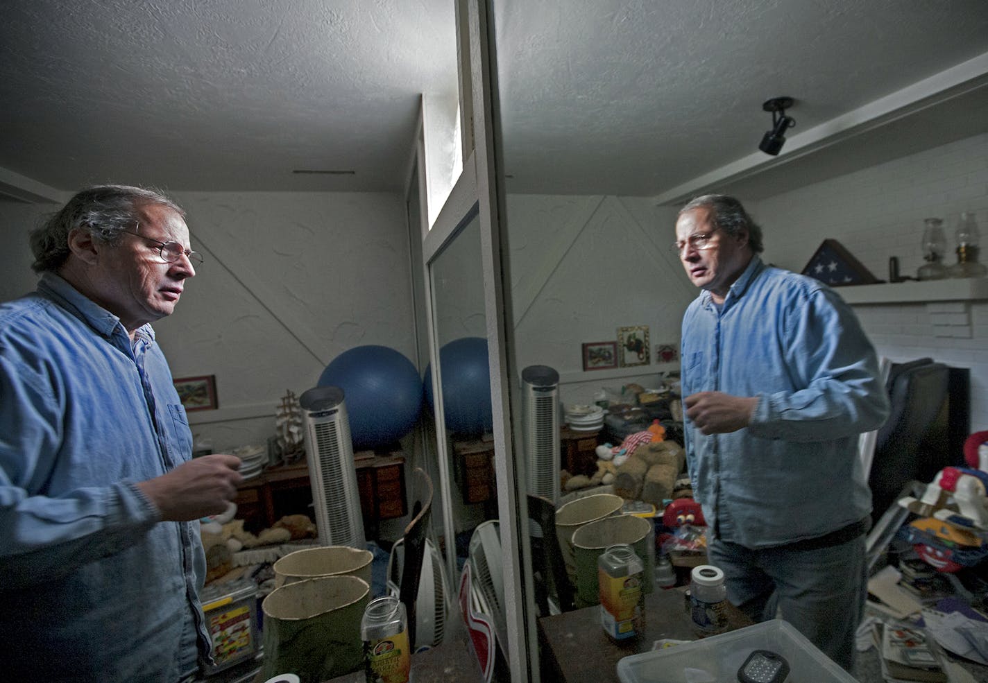 Bob McLean describes how a room currently used for storage will be turned into a sitting area as he describes the renovations he and his wife are doing to prepare for the day they need to sell their house in Prior Lake January 4, 2014. (Courtney Perry/Special to the Star Tribune) ] Their house is not currently on the market, and they don't plan to sell anytime soon. ORG XMIT: MIN1401051735141949