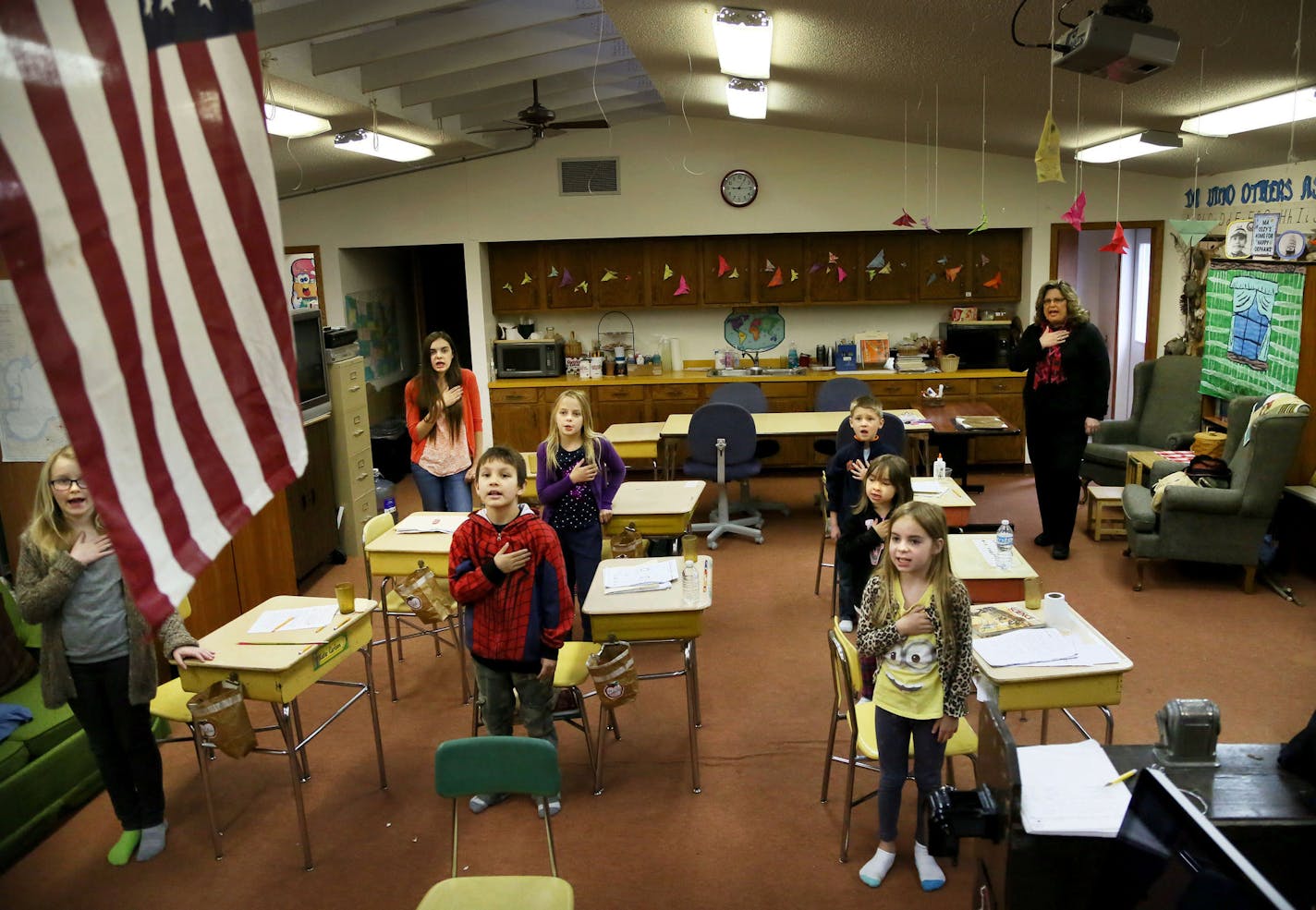 Angle Inlet School's eight students and teacher Linda LaMie say the Pledge of Allegiance to start the day Monday, May 11, 2015,, in Angle Inlet, MN. The Angle Inlet School is the last public one-room school in Minnesota in the most northernmost point of the 48 contiguous states.](DAVID JOLES/STARTRIBUNE)djoles@startribune.com For three decades, Linda LaMie has been the only teacher at the Angle Inlet School, the last one-room public school in Minnesota. The remote outpost sits at the northernmos