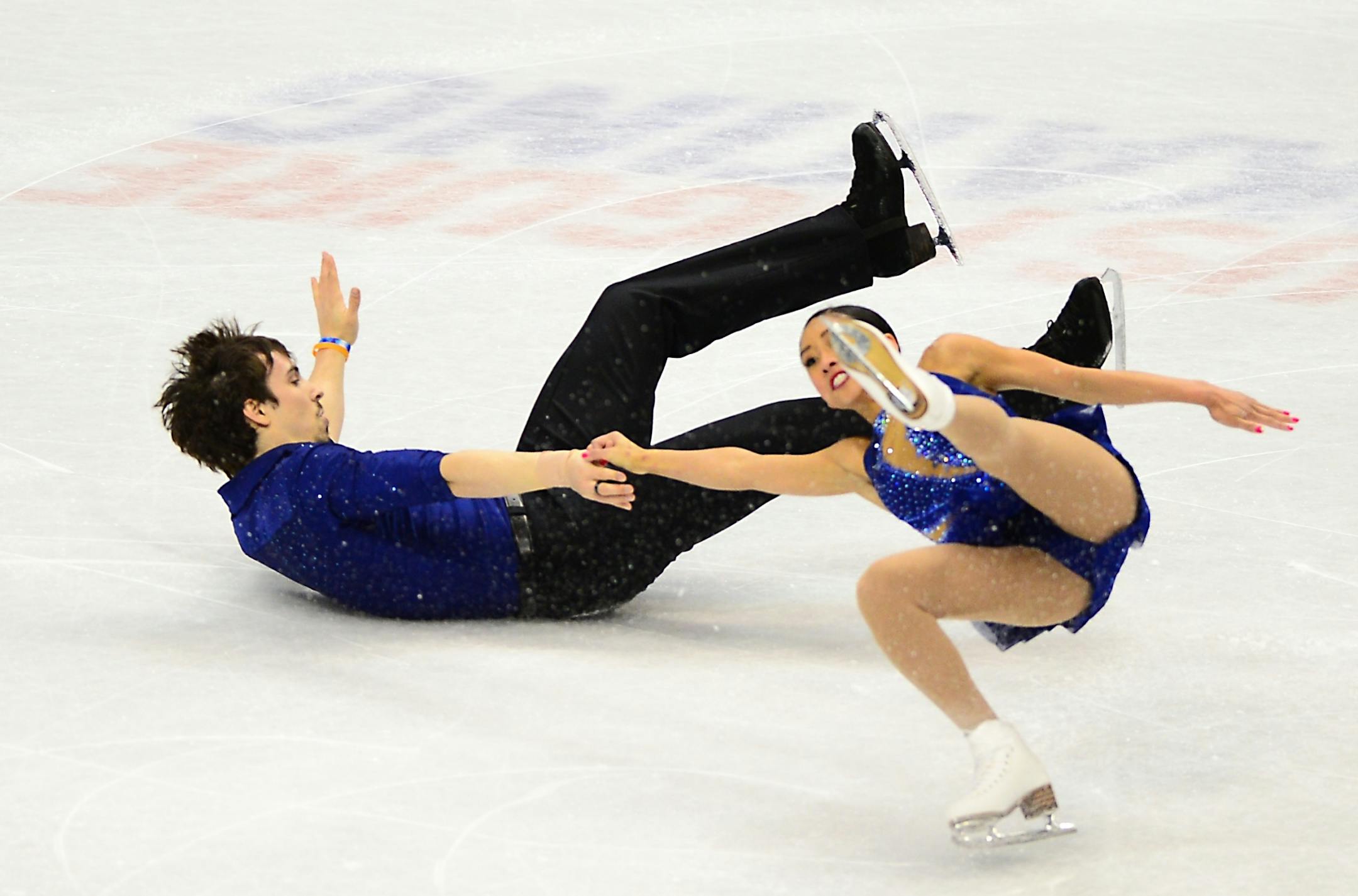 Jessica Calalang and Zack Sidhu both fell attempting their outside spin component of their championship pairs short program performance Thursday.