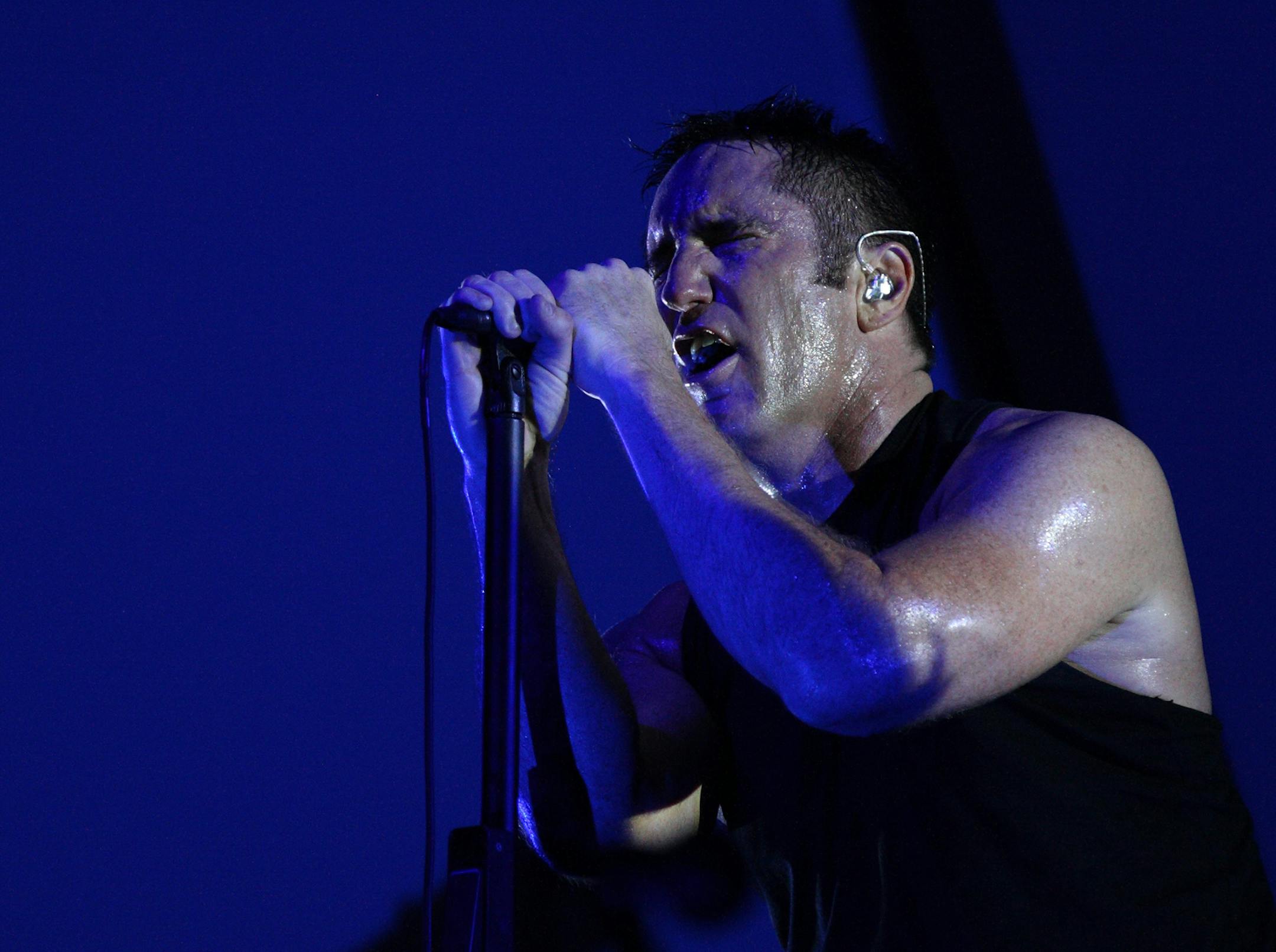 Trent Reznor of the rock group Nine Inch Nails performs on day 1 of Lollapalooza 2013 at Grant Park on Friday, Aug.2, 2013 in Chicago. (Photo by Steve Mitchell/Invision/AP) ORG XMIT: INVW