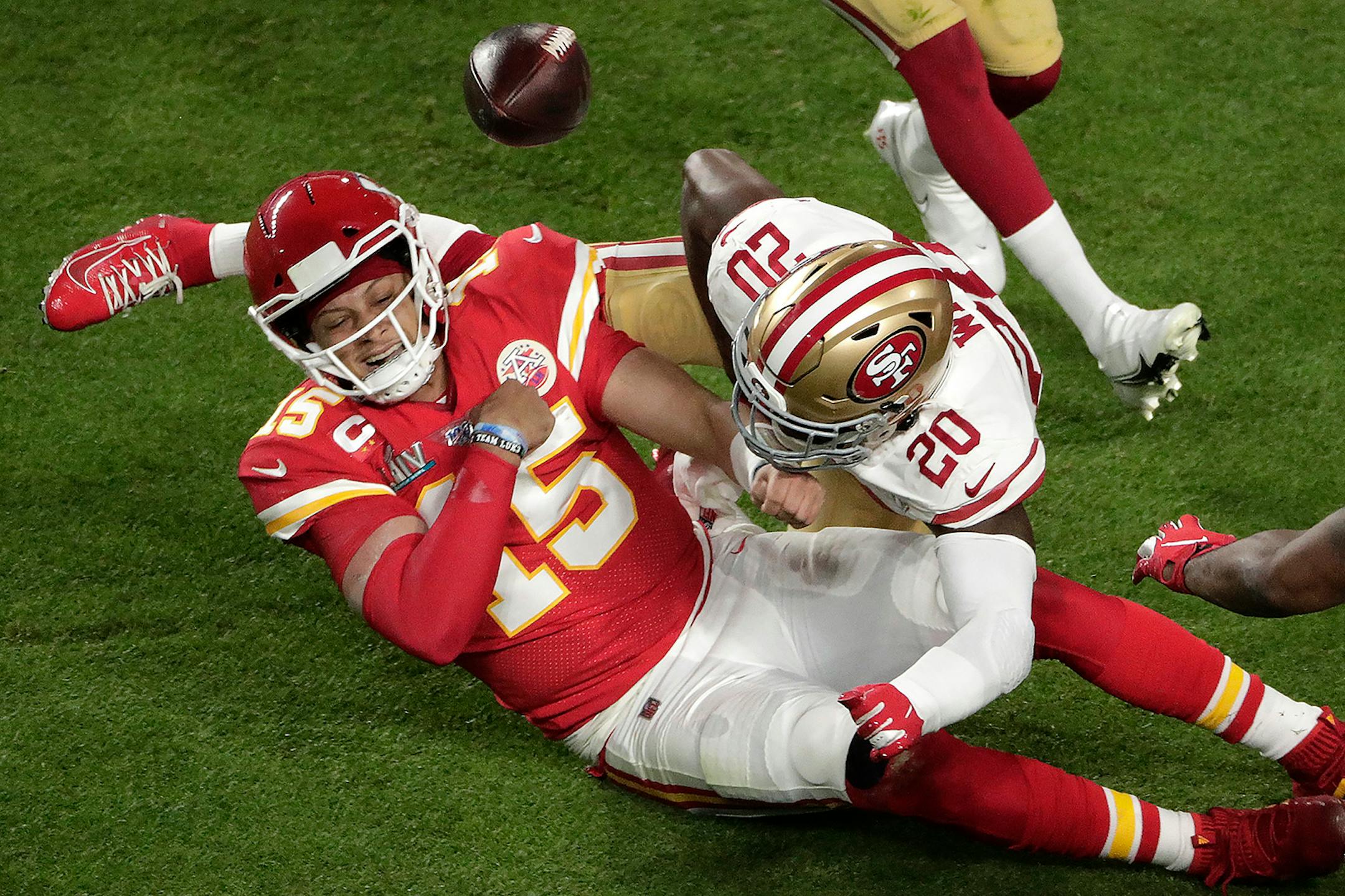 Kansas City Chiefs' Morris Claiborne (20) knocks the ball from the hands of Kansas City Chiefs quarterback Patrick Mahomes (15), during the first half of the NFL Super Bowl 54 football game, Sunday, Feb. 2, 2020, in Miami Gardens, Fla.