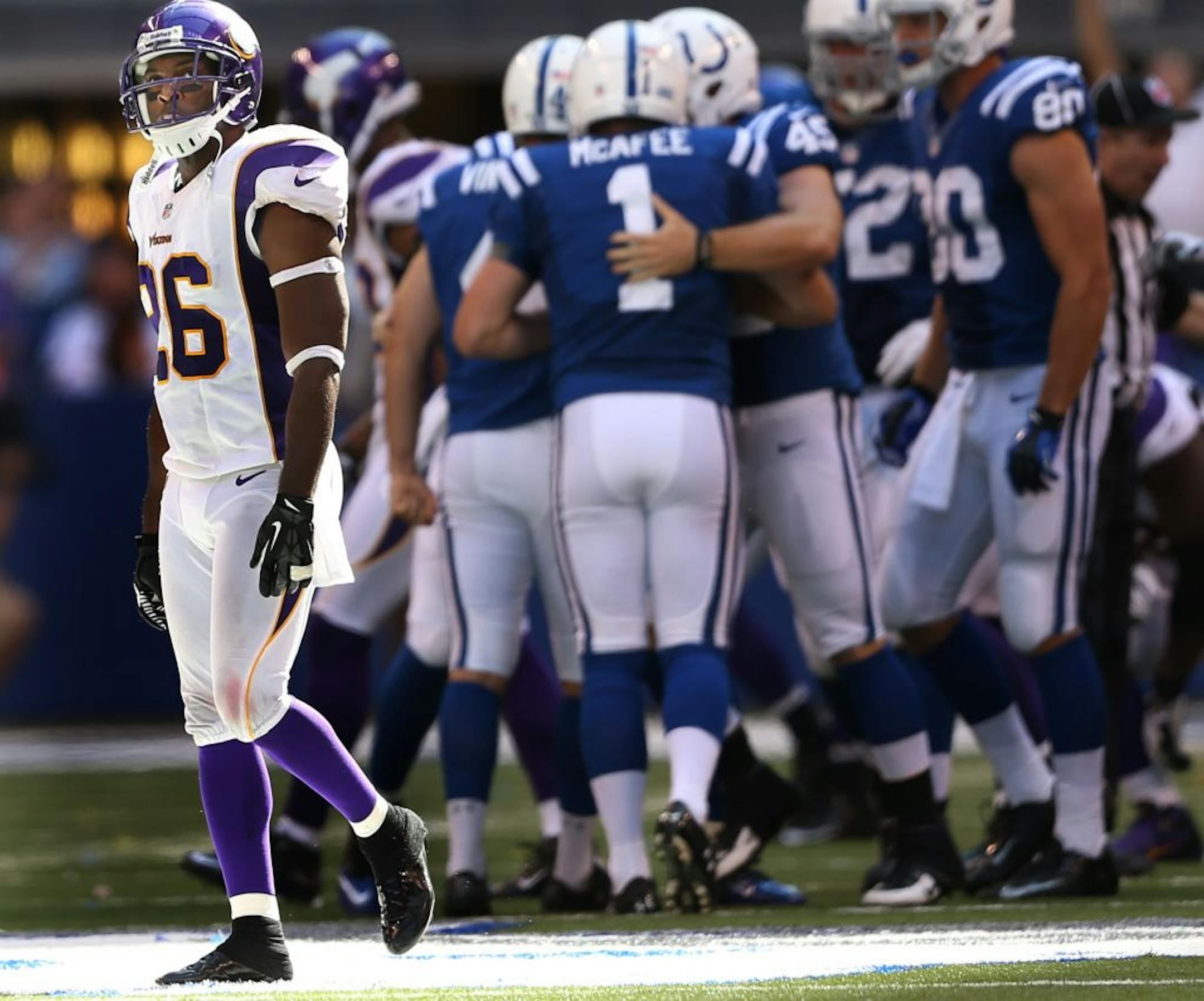Vikings cornerback Antoine Winfield walked off the field after Colts kicker Adam Vinatieri kicked a 53-yard field goal to give the Colts a 23-20 victory Sunday.