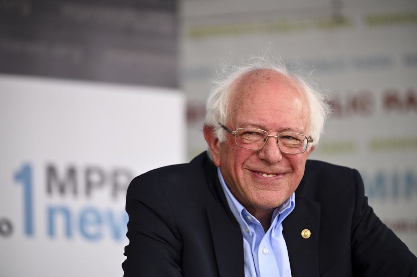 Democratic presidential candidate Sen. Bernie Sanders, I-Vermont, smiled to one of his supporters as he spoke at MPR's booth at the Minnesota State Fair Saturday.