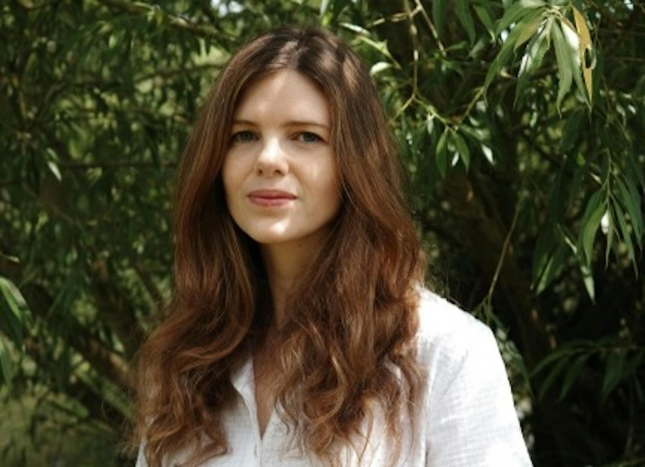 photo of author Xenobe Purvis in front of a tree