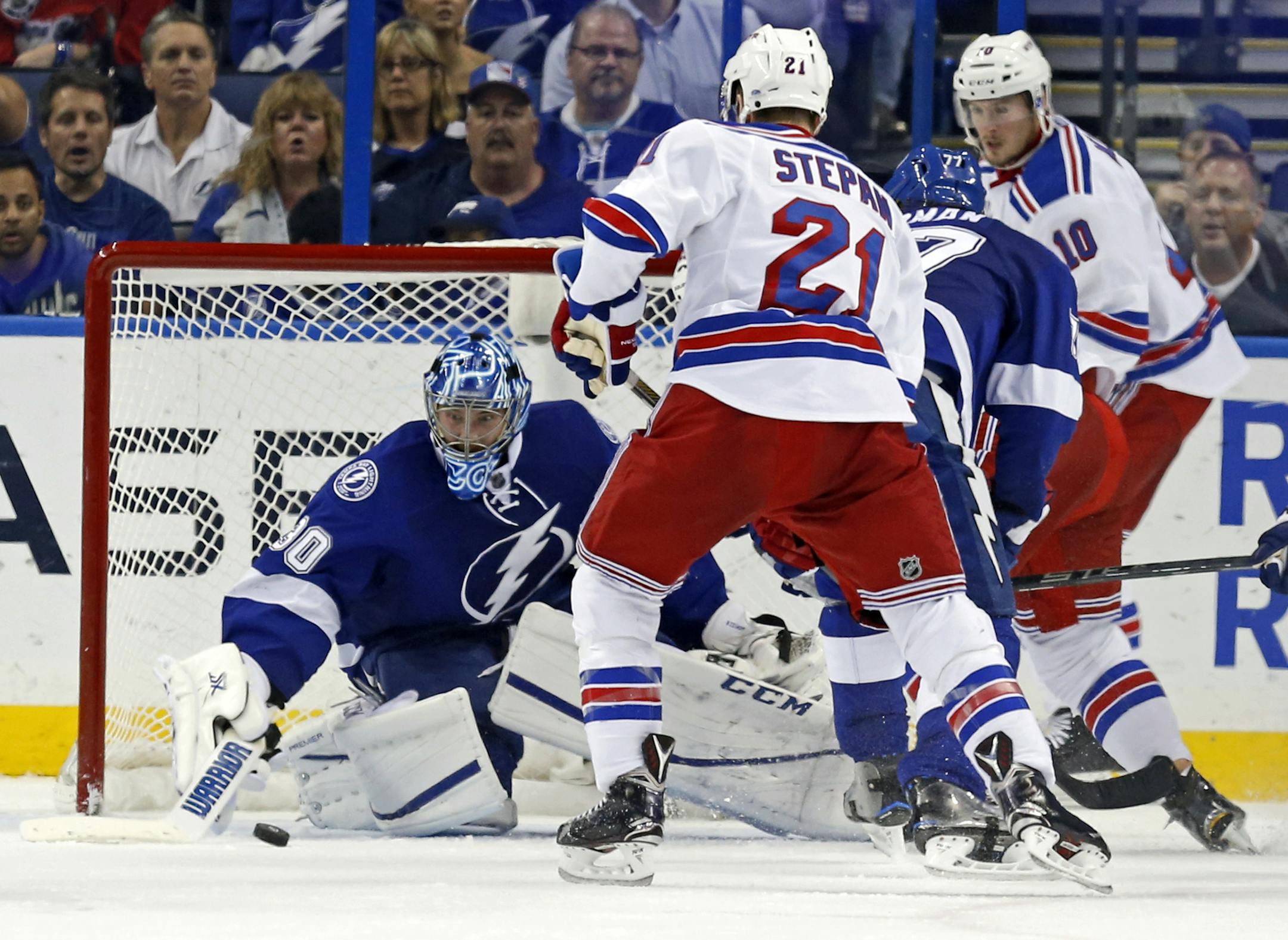 Tampa Bay Lightning goalie Ben Bishop makes a save against New York Rangers' Derek Stepan (21) during the second period of an NHL hockey game Thursday, Nov. 19, 2015, in Tampa, Fla. (AP Photo/Mike Carlson)