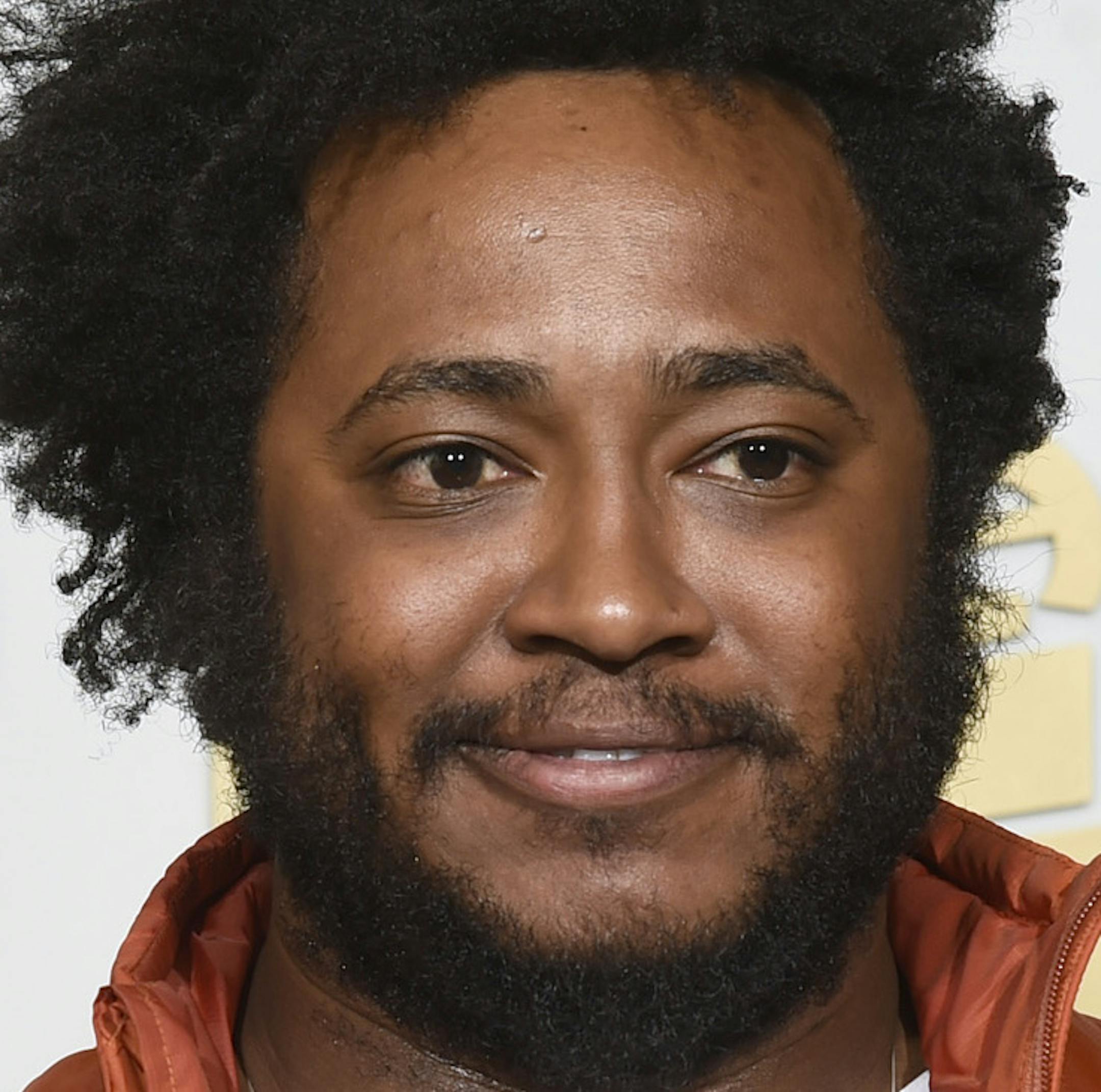 Thundercat poses in the press room with the award for best rap/sung collaboration for ìThese Wallsî at the 58th annual Grammy Awards at the Staples Center on Monday, Feb. 15, 2016, in Los Angeles. (Photo by Chris Pizzello/Invision/AP)