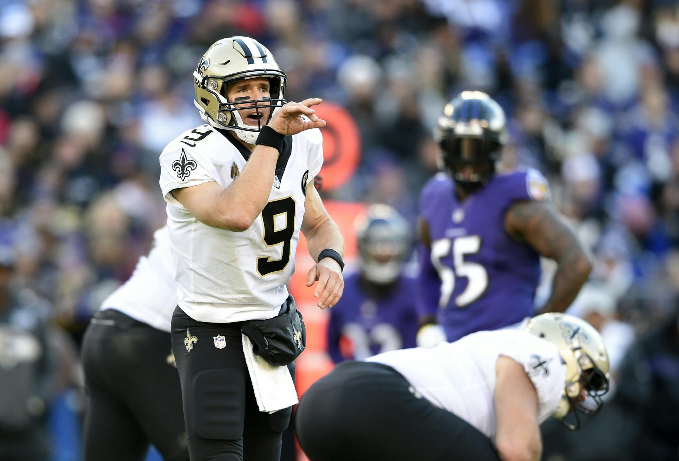 New Orleans Saints quarterback Drew Brees prepares to run a play in the first half of an NFL football game against the Baltimore Ravens, Sunday, Oct. 21, 2018, in Baltimore. (AP Photo/Gail Burton)