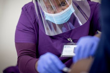 Jenipher Onsarigo, RN, administered the Johnson and Johnson Covid-19 vaccination to women at the vaccination site at the Masjid Al Tawba Mosque, Thurs