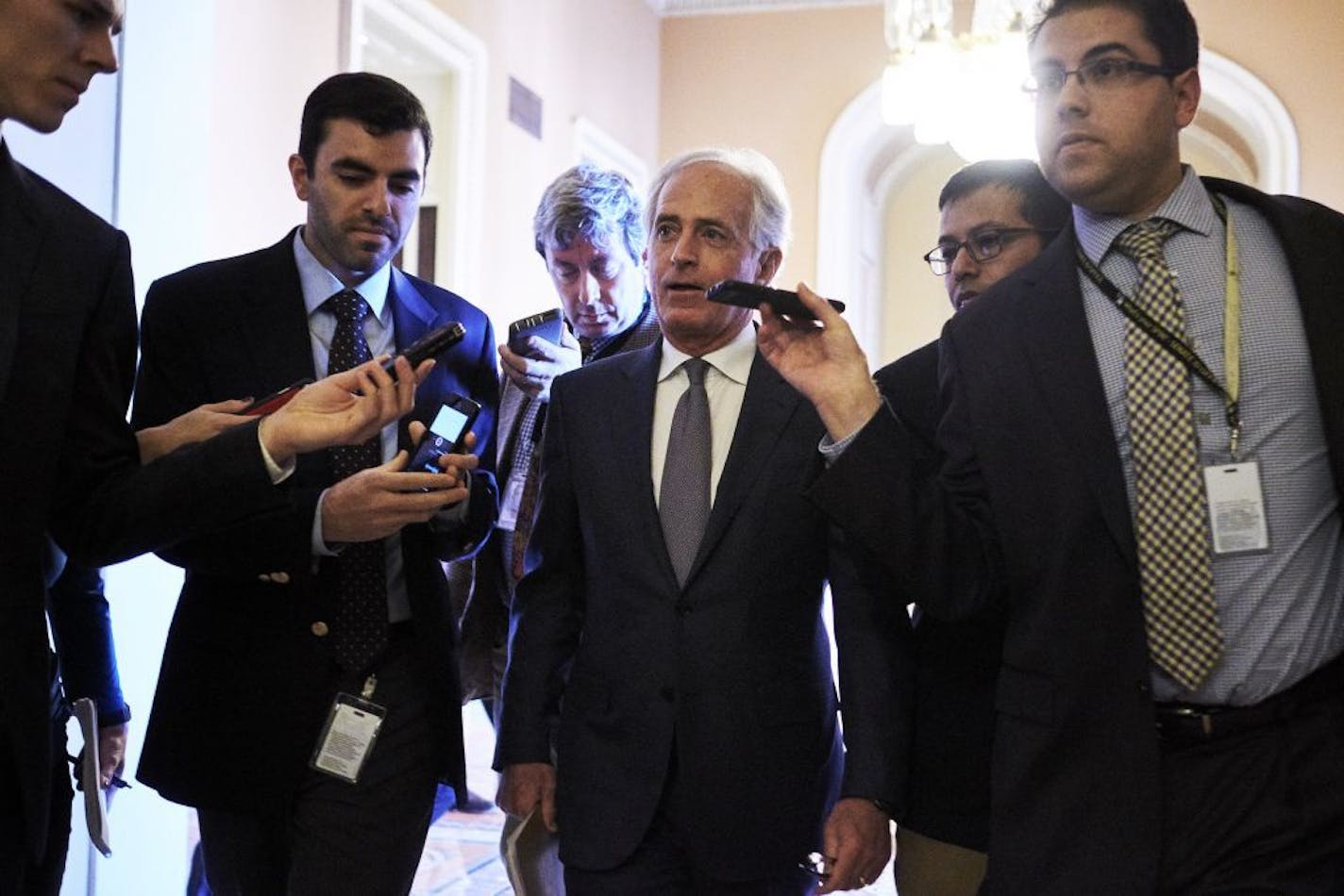 Sen. Bob Corker (R-Tenn.) talks to reporters en route to the Senate floor, on Capitol Hill in Washington, Dec. 1, 2017. Senate Republicans once again appeared to have the momentum to pass their sweeping tax bill after party leaders picked up the votes of three holdouts.