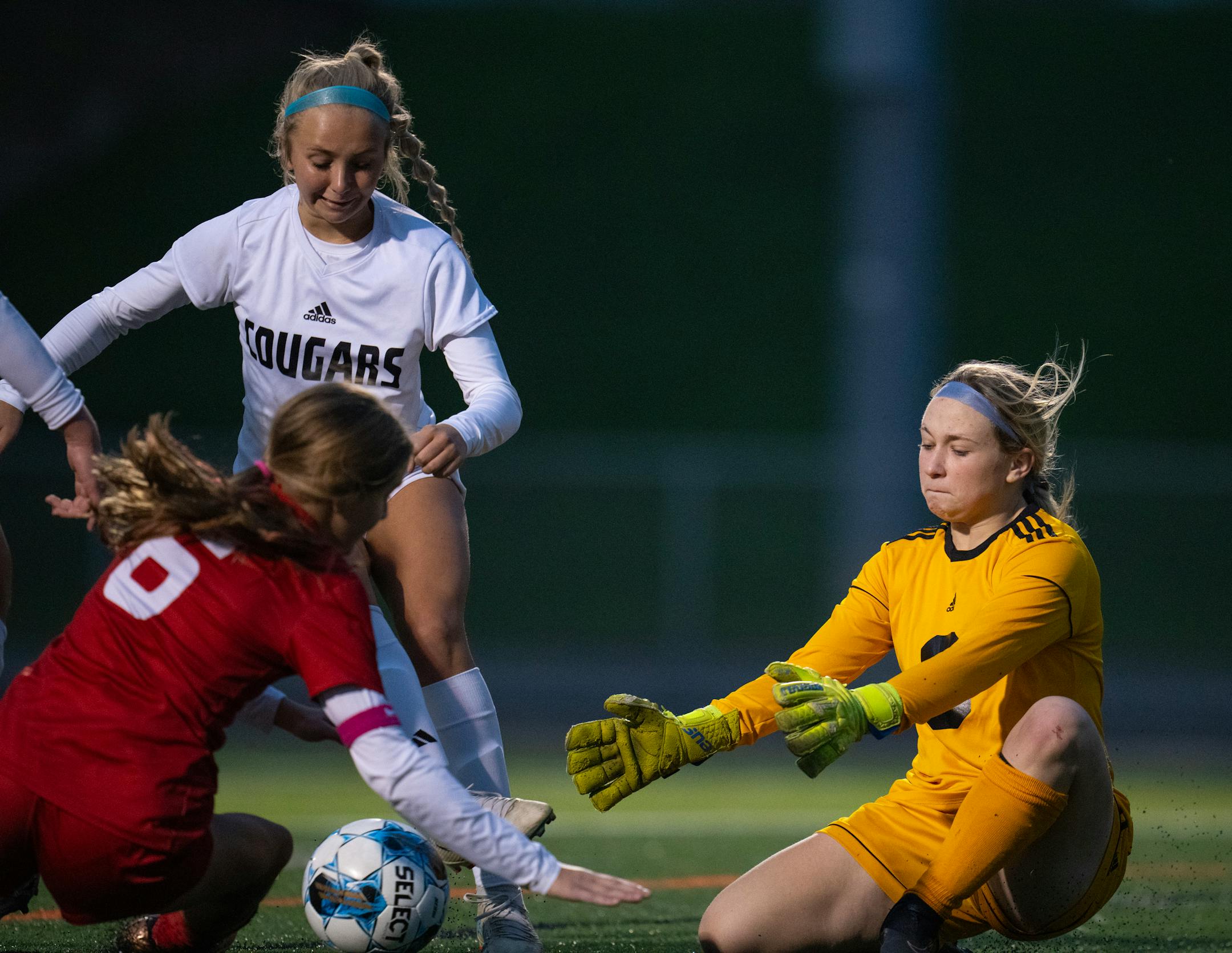 Mankato East keeper Ashley Fischer reached for a loose ball in front of her net in the first half.