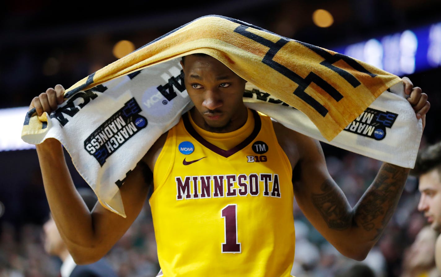 Minnesota guard Dupree McBrayer reacts on the bench at the end of a second round loss against Michigan State