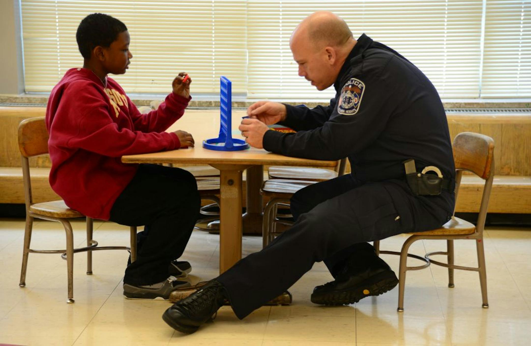 Crime was up and the community's faith in police was faltering when Scott Nadeau took over as Columbia Heights police chief in 2008. Realizing that police could not "arrest their way of out the problem," he instituted a series of community policing efforts with churches, businesses, neighborhoods and schools. Now, 10 of Nadeau's 28 officers are part of the "Big Brother Big Sister" program. The officers meet with the kids at Highland Elementary for lunch and games. The chief's community policing
