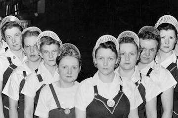 Female employees of the Twin Cities Ordnance Plant, later known as Twin Cities Army Ammunition Plant, posed for a photo during World War II. 