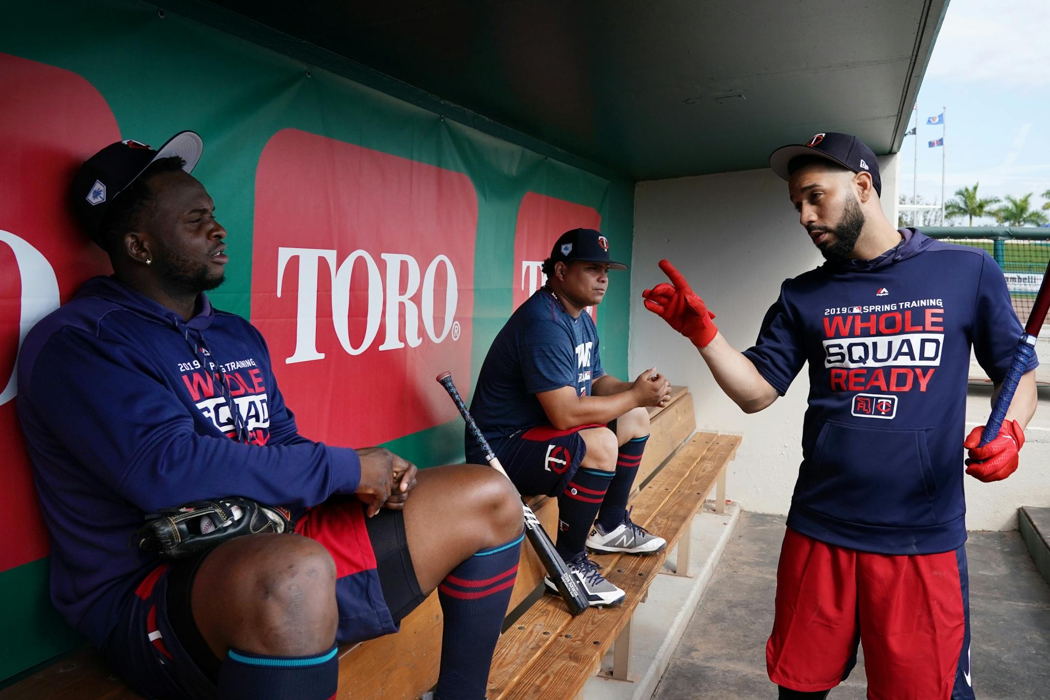 Newly acquired Minnesota Twins utility player Marwin Gonzalez (9) talked with third baseman Miguel Sano (22) in the dugout before batting practice Monday morning.