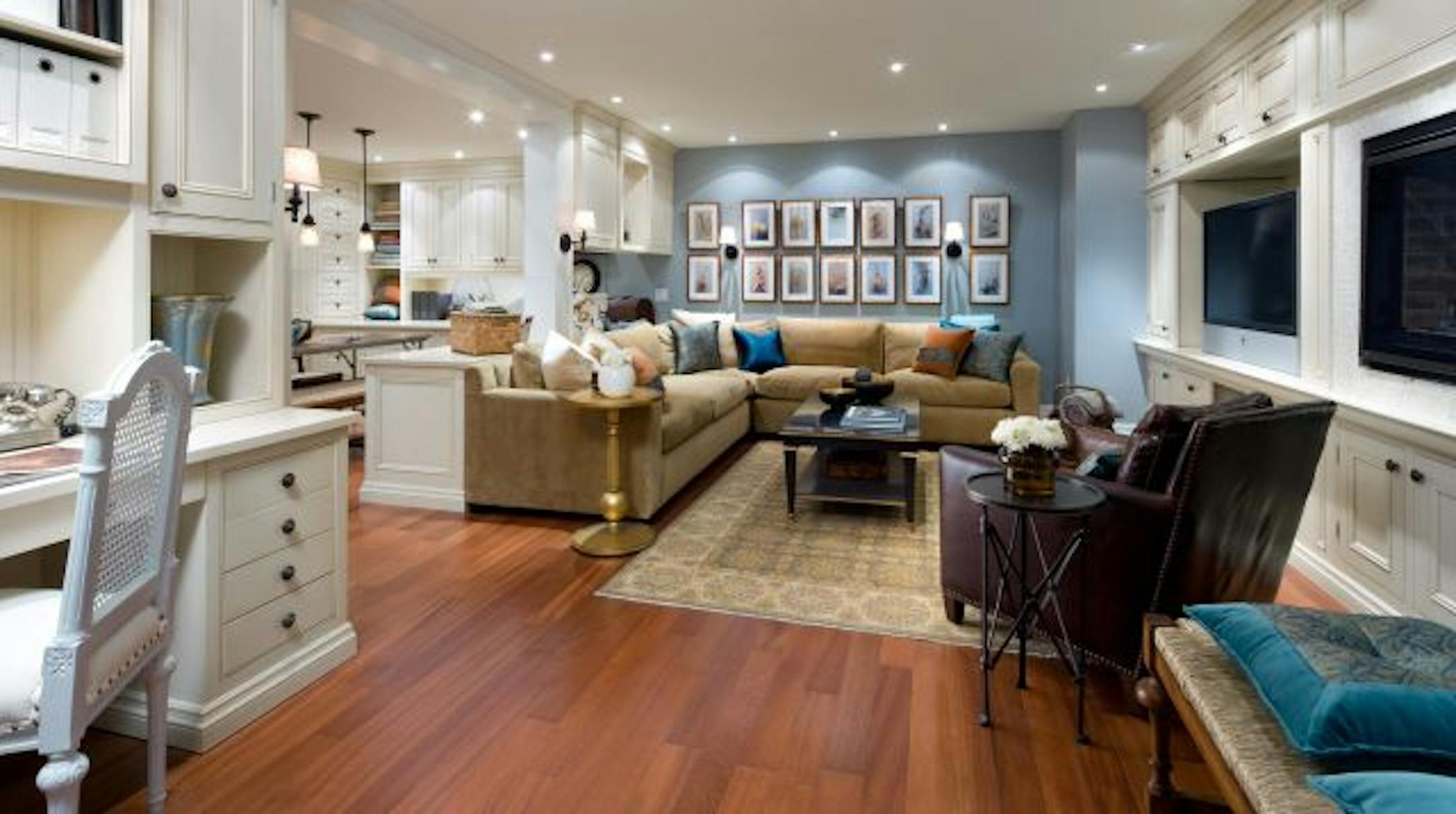 After: By combining warm colors, comfortable furniture, traditional details and well-placed lighting, this family room is now ready for crafts, calculus and cozying up by the fire.
