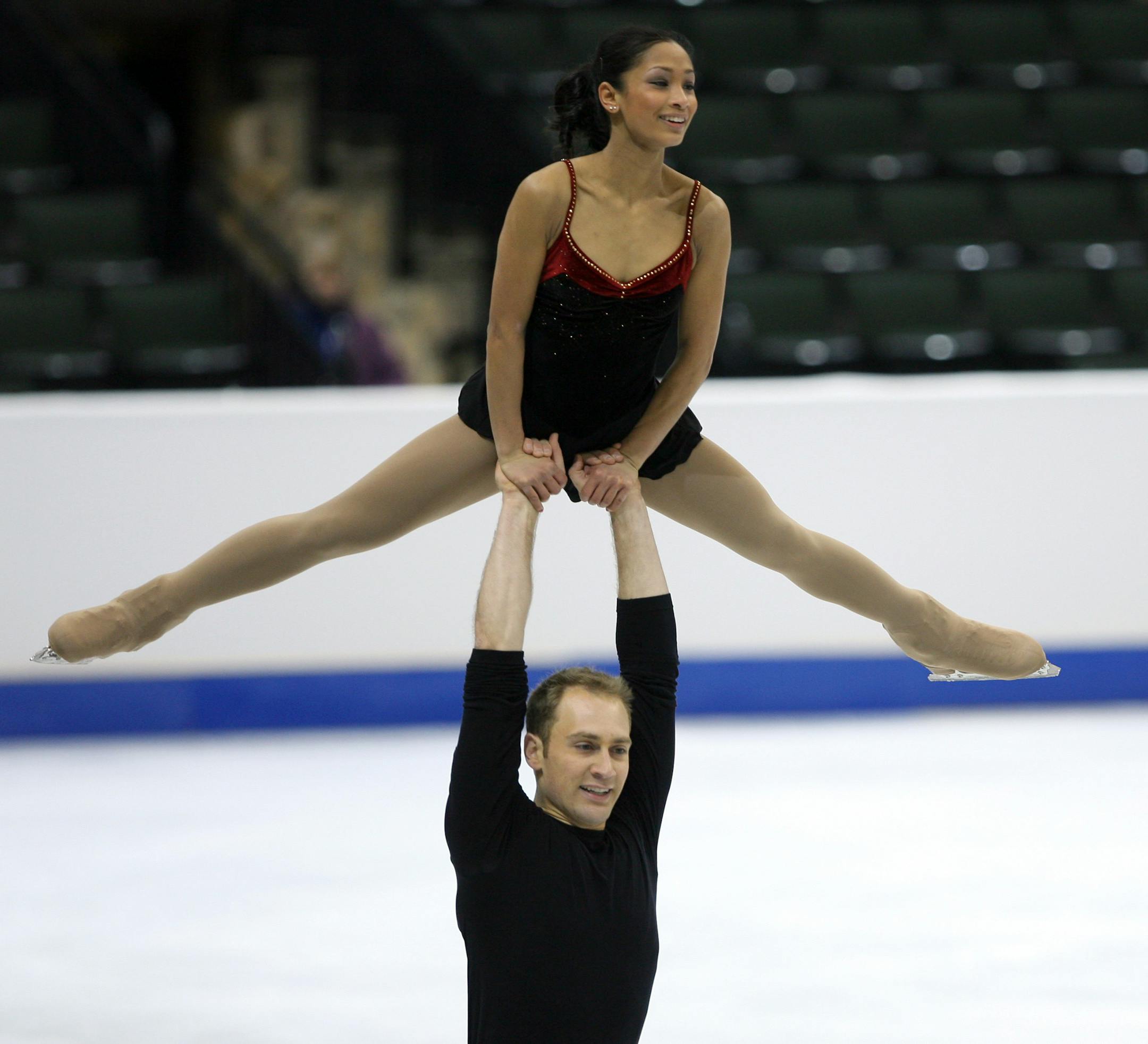Mark Ladwig carried Amanda Evora high above him as they skated through their program during a morning practice at Xcel Energy Center in St. Paul.