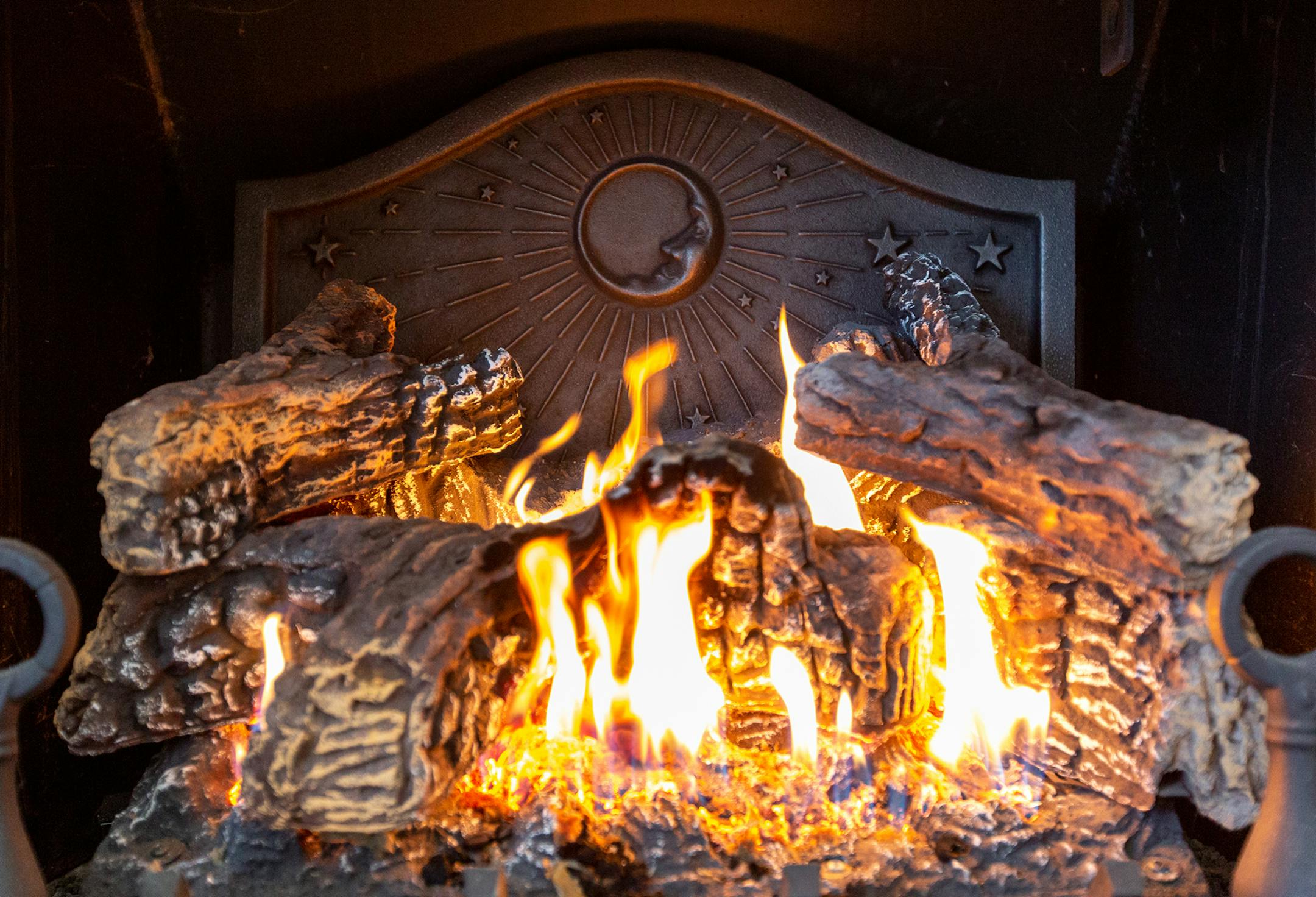 One of J. Del Conner's firebacks is used in his home, which doubles as a studio, in Hamburg, Pa., on February 21, 2019. Firebacks are used to protect the bricks in a fireplace and they help to push heat back into the house. (Margo Reed/Philadelphia Inquirer/TNS) ORG XMIT: 1282820