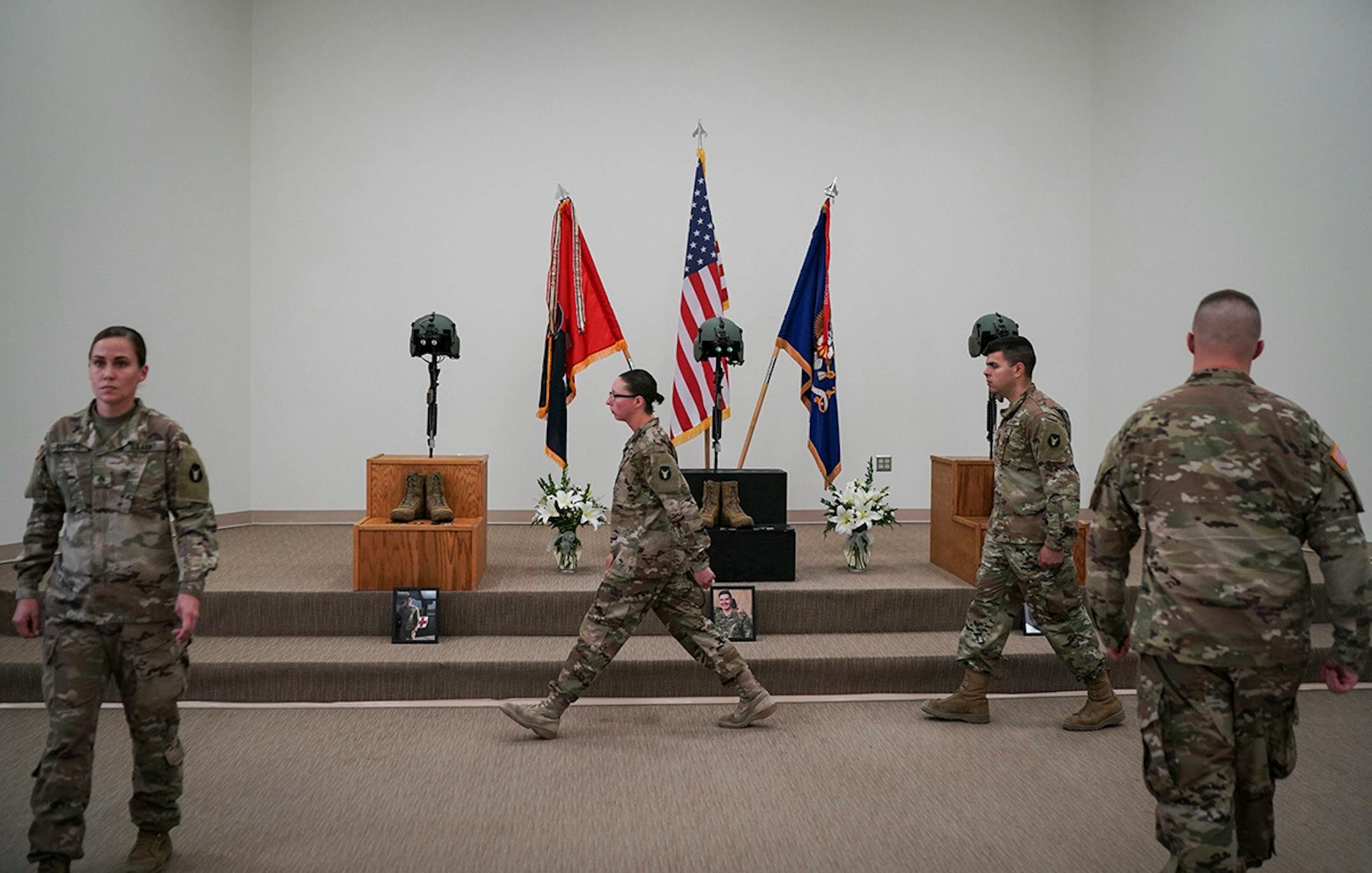 Soldiers walked in formations as they each took their turn to pay tribute to the memorials of the three soldiers who died during a training exercise in Minnesota last week.