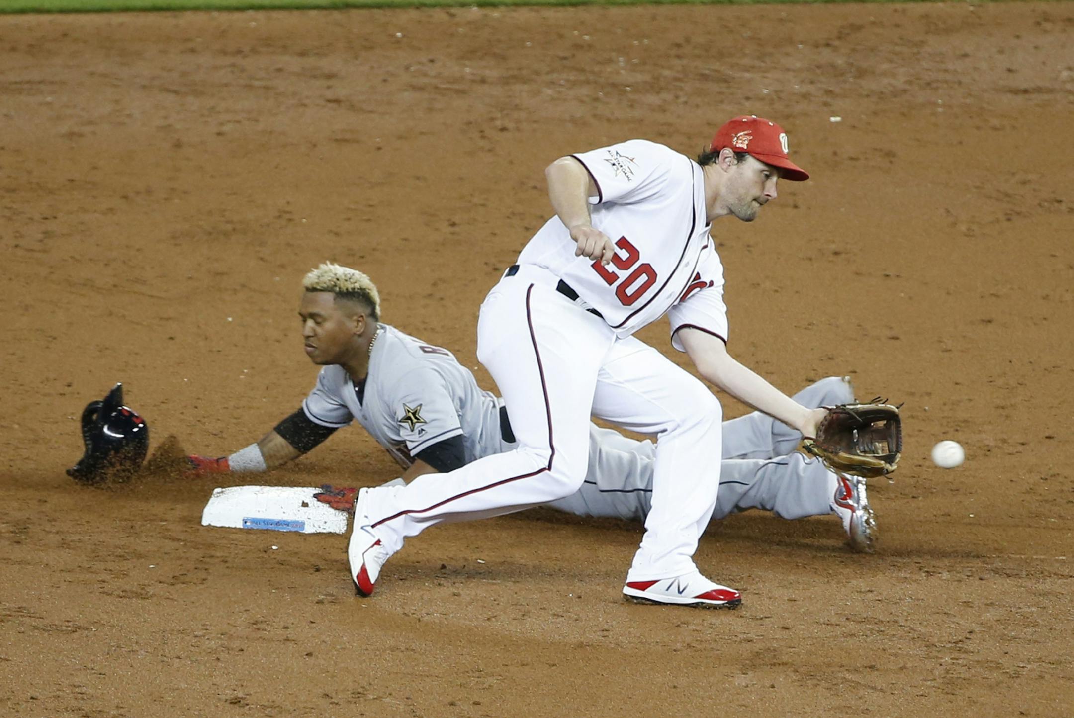 American League's Cleveland Indians Jos� Ramlrez (11) steals second base as National League's Washington Nationals second baseman Daniel Murphy (20) is late with the tag, during the third inning, during the MLB baseball All-Star Game, Tuesday, July 11, 2017, in Miami.