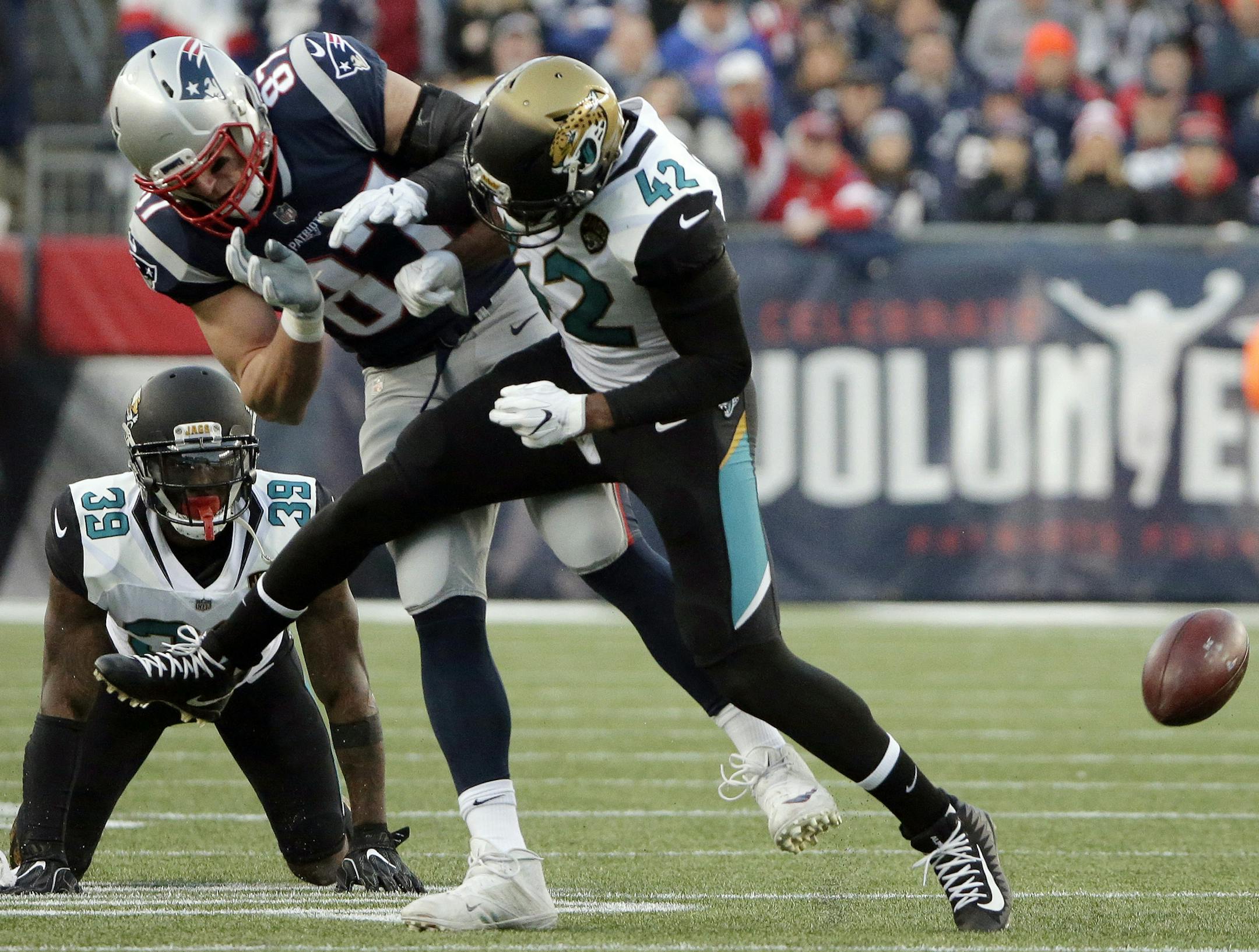 New England Patriots tight end Rob Gronkowski (87) is hit by Jacksonville Jaguars safety Barry Church (42) as he breaks up a pass during the first half of the AFC championship NFL football game, Sunday, Jan. 21, 2018, in Foxborough, Mass. (AP Photo/Steven Senne)