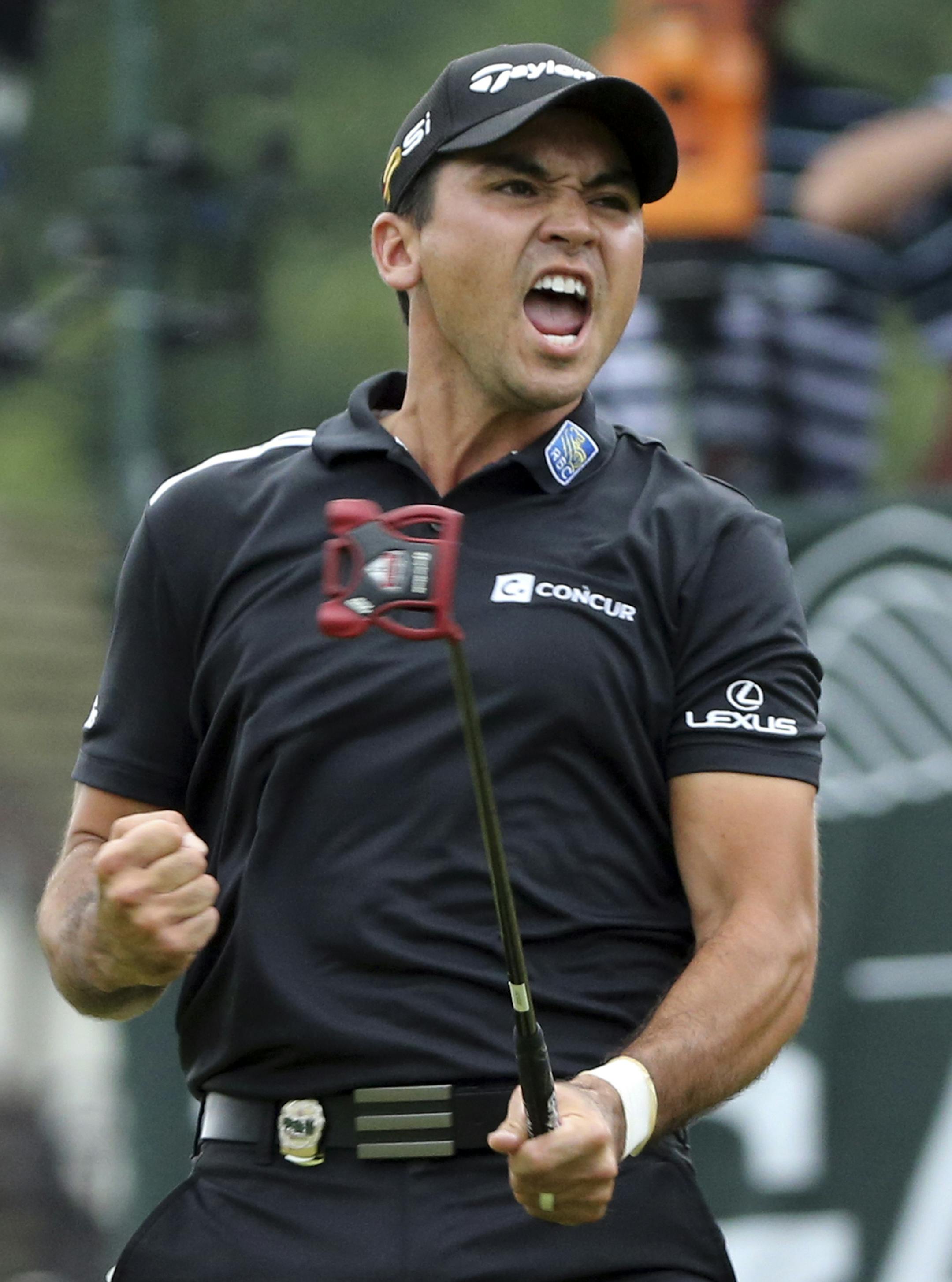 Jason Day reacts after making an eagle putt on the 18th hole during the final round of the PGA Championship golf tournament at Baltusrol Golf Club in Springfield, N.J., Sunday, July 31, 2016. (AP Photo/Seth Wenig)
