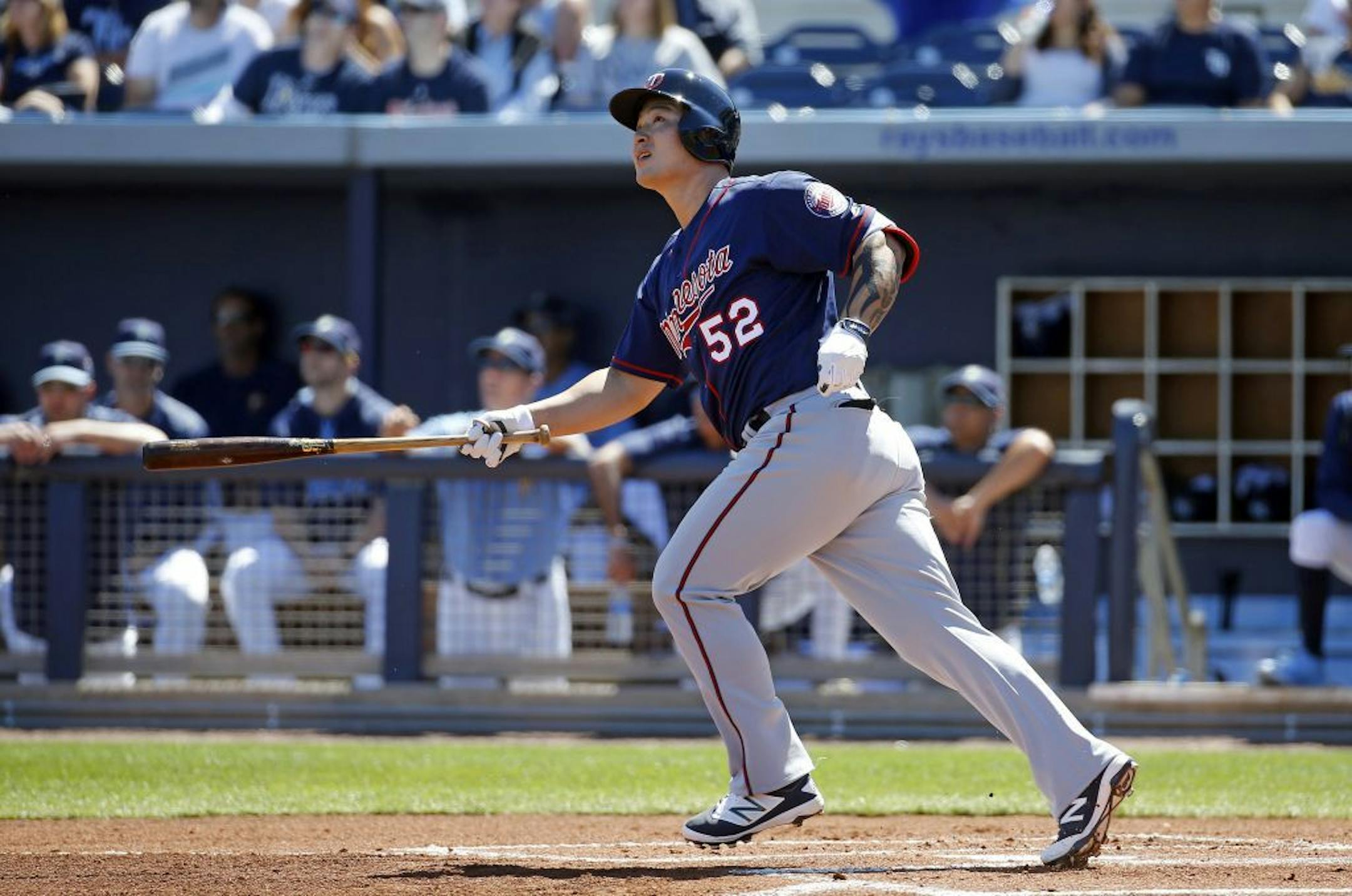 New Twins slugger Byung Ho Park watched his grand slam home run in the first inning of a spring training game against the Tampa Bay Rays in Port Charlotte, Fla., on Sunday.