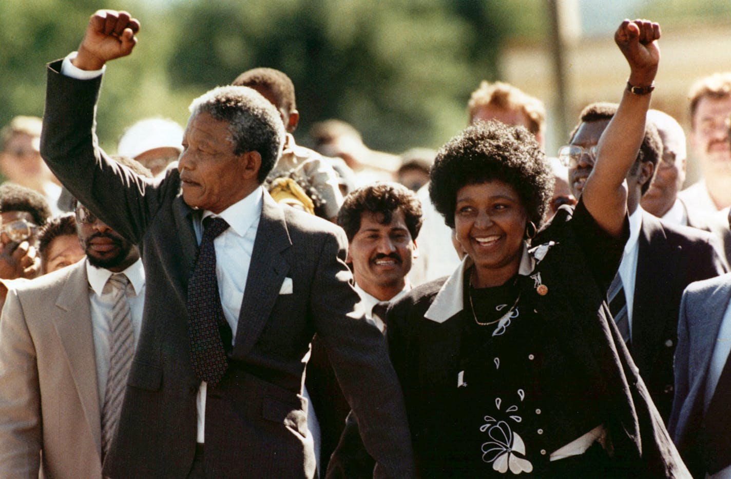 FILE - In this Feb. 11, 1990 file photo, Nelson Mandela, left, and his wife Winnie, raise clenched fists as they walk hand-in-hand from the Victor Verster prison near Cape Town, South Africa.