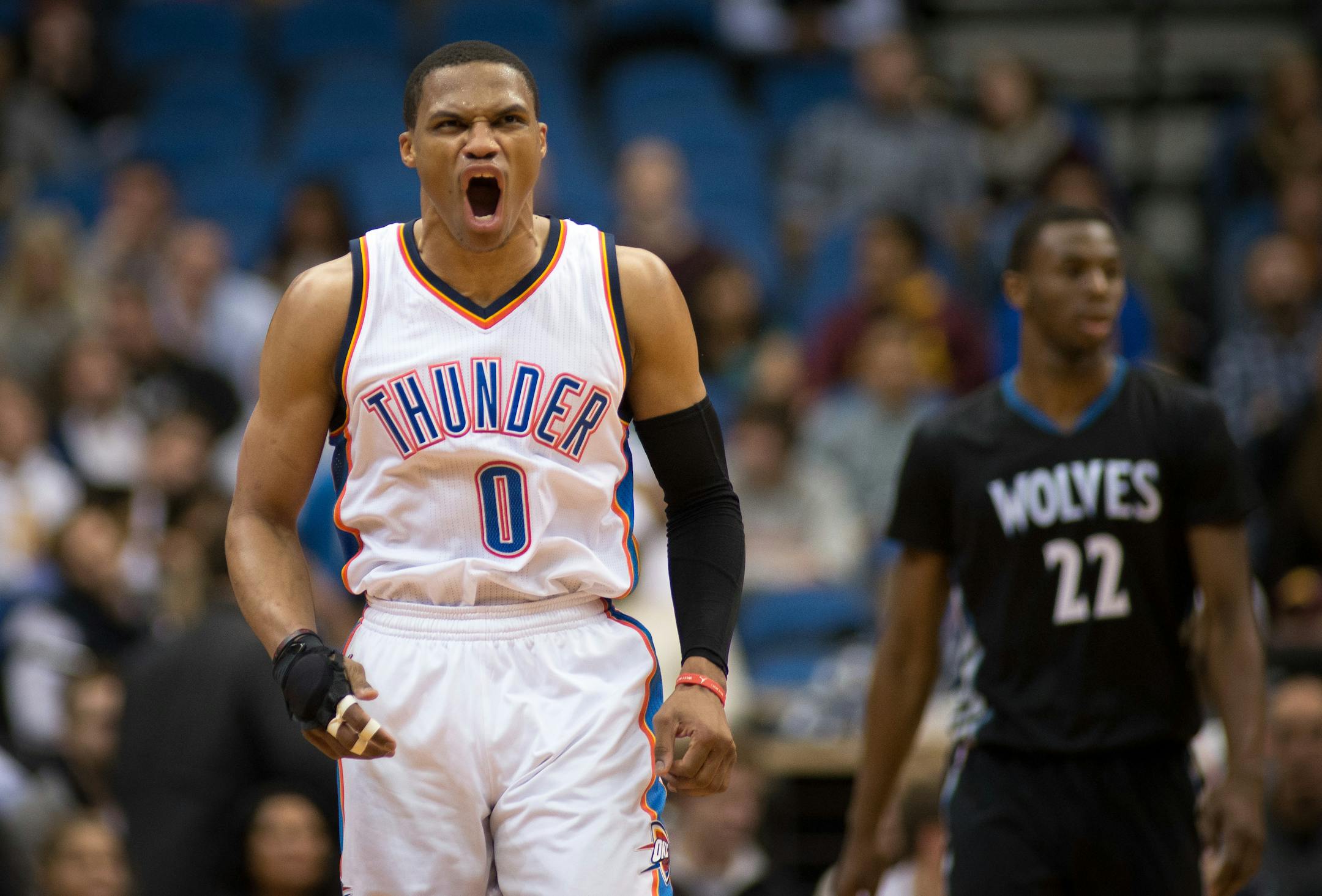 Oklahoma City Thunder guard Russell Westbrook (0) lets out a howl after hitting a three-point shot against the Timberwolves in the second quarter.
