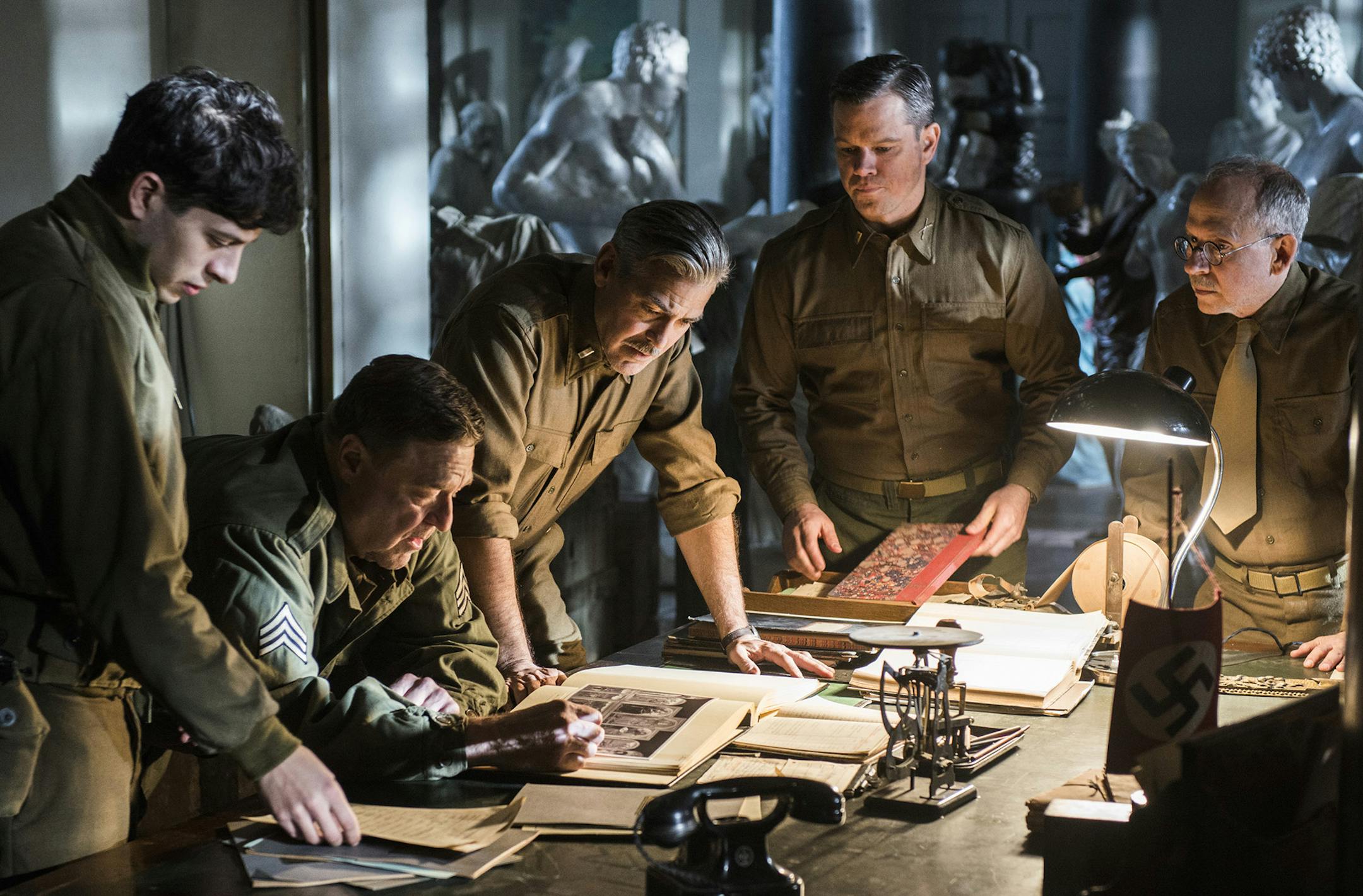 This image released by Columbia Pictures shows from left, Sam Epstein, John Goodman, George Clooney, Matt Damon and Bob Balaban in a scene from "The Monuments Men." (AP Photo/Sony, Columbia Pictures, Claudette Barius) ORG XMIT: MIN2014021010371824