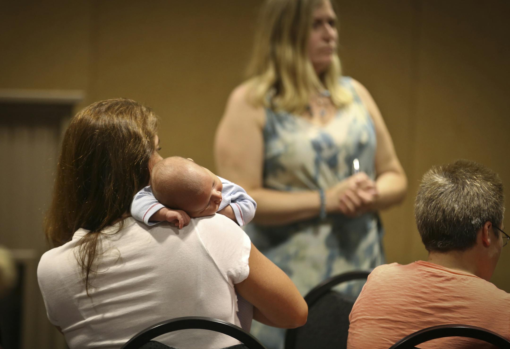 Child care provider Laurie Cornelious held her seven-month-old grandson Gavin (who will soon join her home daycare she runs with her daughter) during a meeting on the unionizing of home-based child care during a meeting in Savage, Minn., on Tuesday, September 10, 2013. ] (RENEE JONES SCHNEIDER • reneejones@startribune.com)