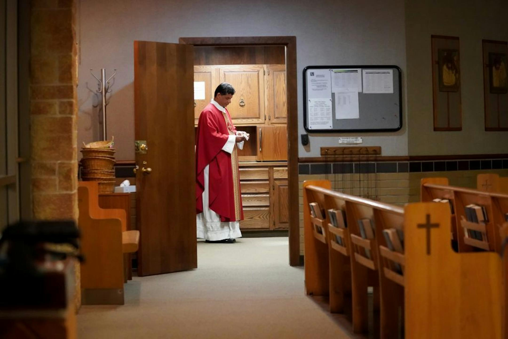 Fr. Antony Skaria prepared for a weekday morning Mass at St. John Vianney Catholic Church in South St. Paul, Minnesota.