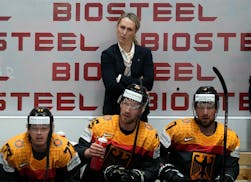 Jessica Campbell stands behind the German bench during a Hockey World Championship game between France and Germany in 2022. Campbell will become the f
