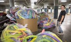 Chris Pennington, the creative director for Can Can Wonderland looks at a donation of 7,000 foam noodles that he received from Target.