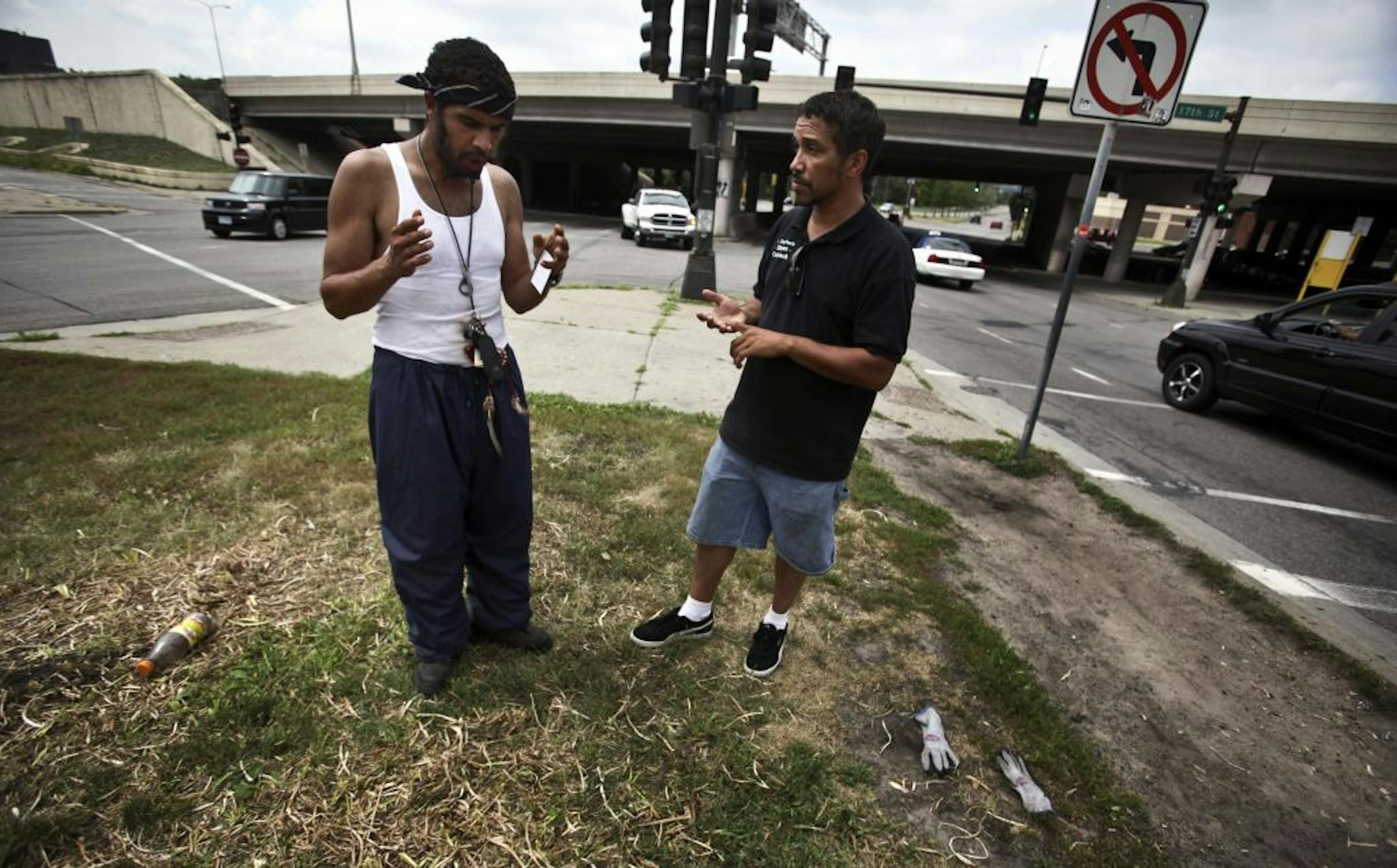 Desenclos, right, talked with Michael Taylor in north Minneapolis. Taylor, who has been homeless for about four years, said there is a lack of resources for people on the streets.