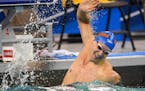 Florida's Caeleb Dressel celebrated his first place win in the men's 50-yard freestyle final Thursday. He finished with a record setting time of 17.63
