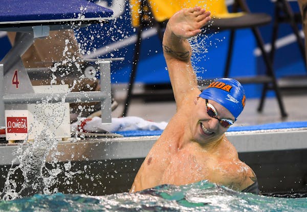 Florida's Caeleb Dressel celebrated his first place win in the men's 50-yard freestyle final Thursday. He finished with a record setting time of 17.63
