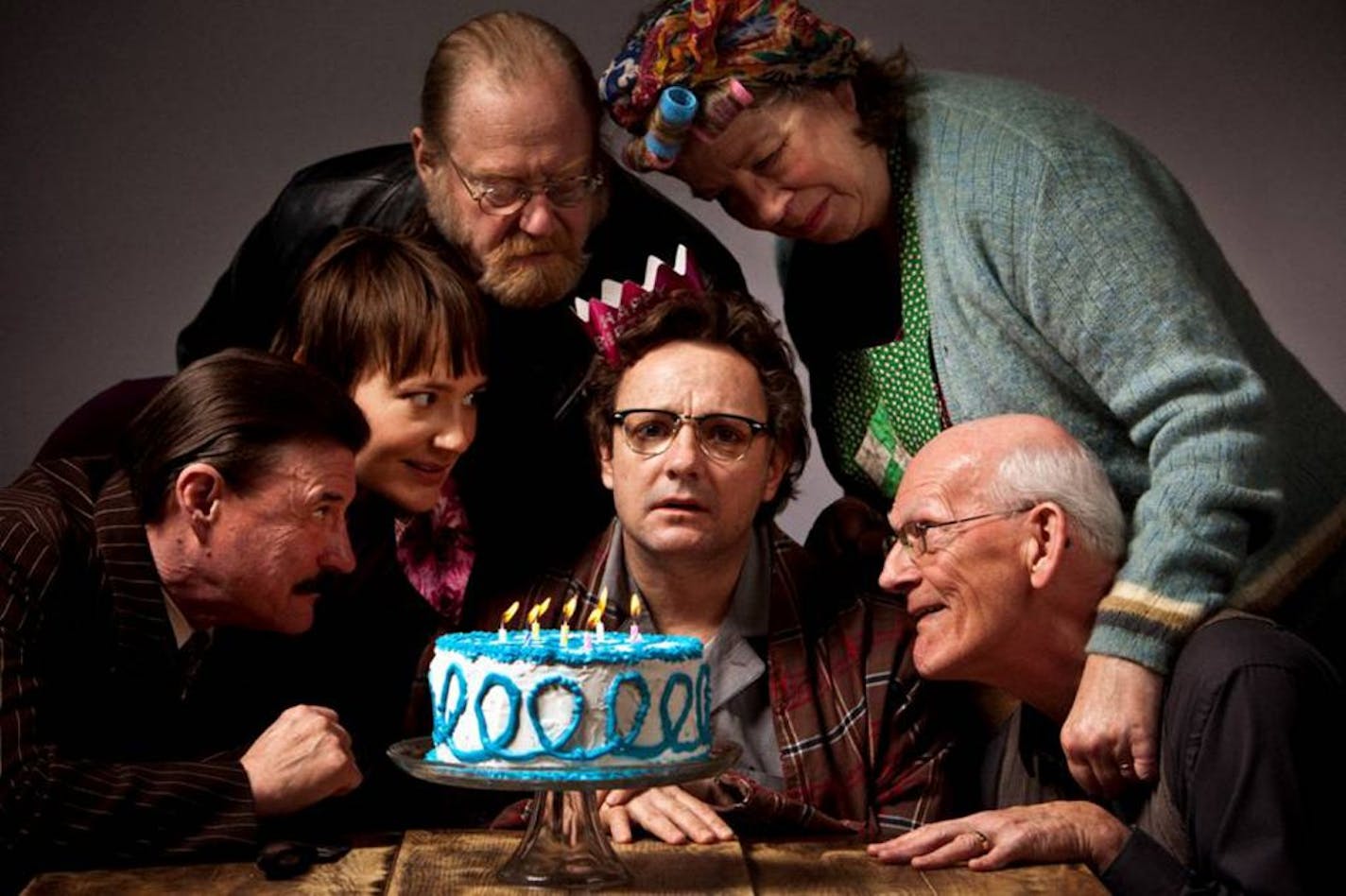 Stephen Cartmell, center, is surrounded by, from left, Tony Papenfuss, Katie Guentzel, Marty Ruben, Claudia Wilkens and Richard Ooms in Harold Pinter's "The Birthday Party" at the Jungle Theater.