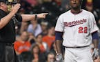 Minnesota Twins' Miguel Sano (22) reacts after being called out on strikes by home plate umpire Hunter Wendelstedt in the eighth inning of a baseball 