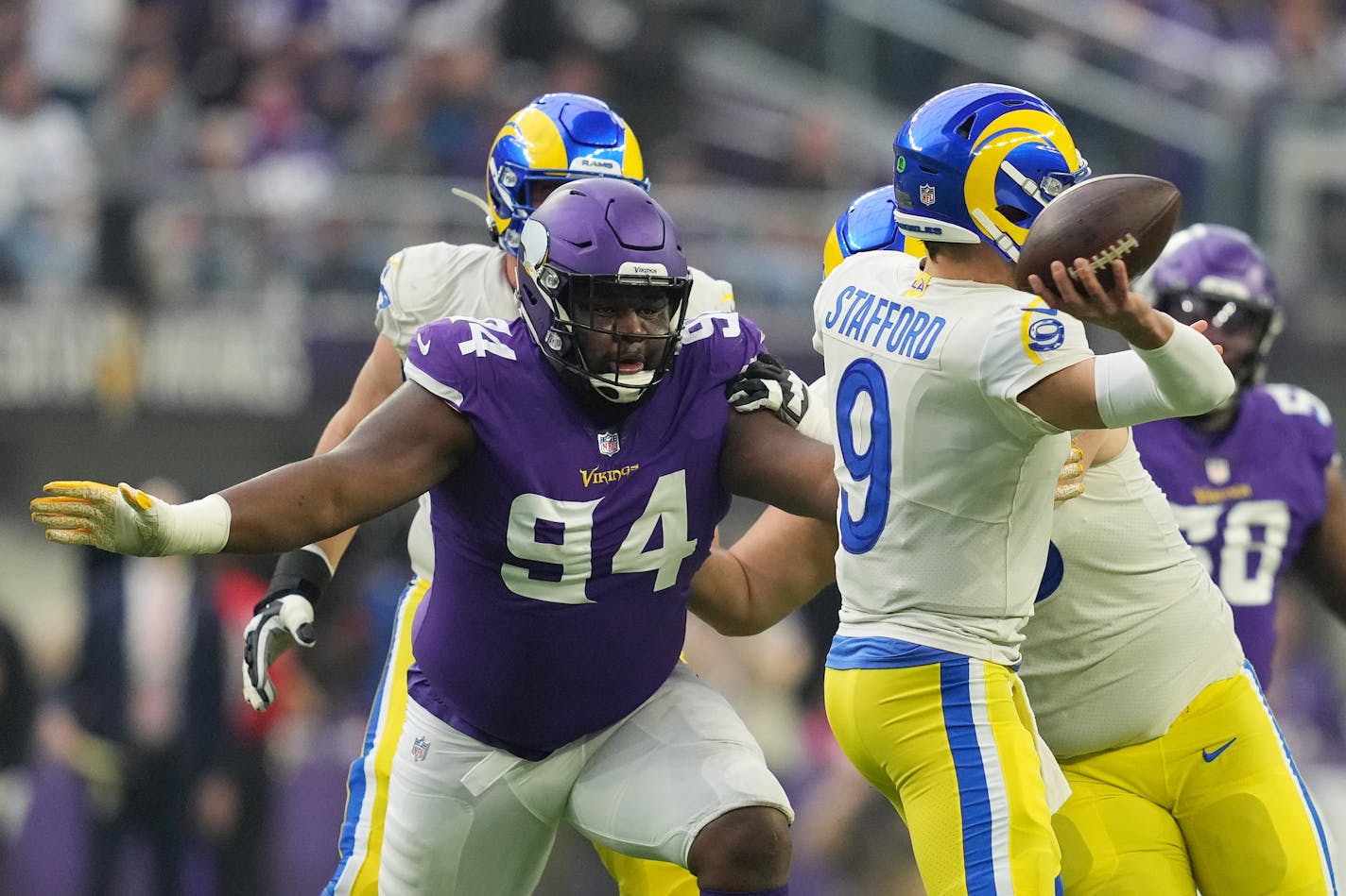 Los Angeles Rams quarterback Matthew Stafford (9) threw under pressure from Minnesota Vikings defensive tackle Dalvin Tomlinson (94) in the first quarter of an NFL game between the Minnesota Vikings and the Los Angeles Rams Sunday, Dec. 26, 2021 at U.S. Bank Stadium in Minneapolis. ] ANTHONY SOUFFLE • anthony.souffle@startribune.com