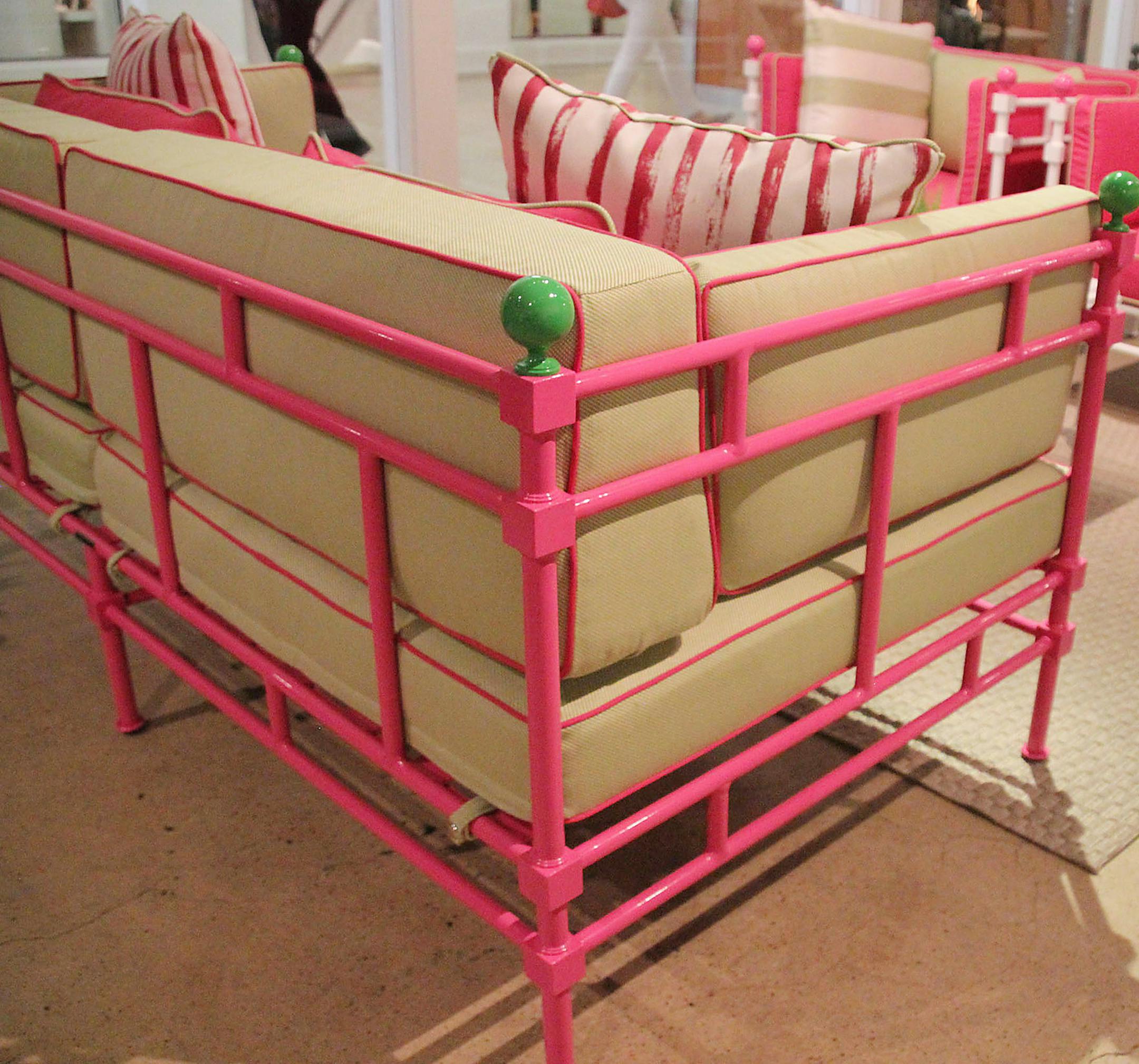 The Deia outdoor sofa from Brown Jordan in preppy pink with green accents and one in white with pink cushions is right on trend for summer. (Patricia Sheridan/Pittsburgh Post-Gazette/TNS) ORG XMIT: 1204080