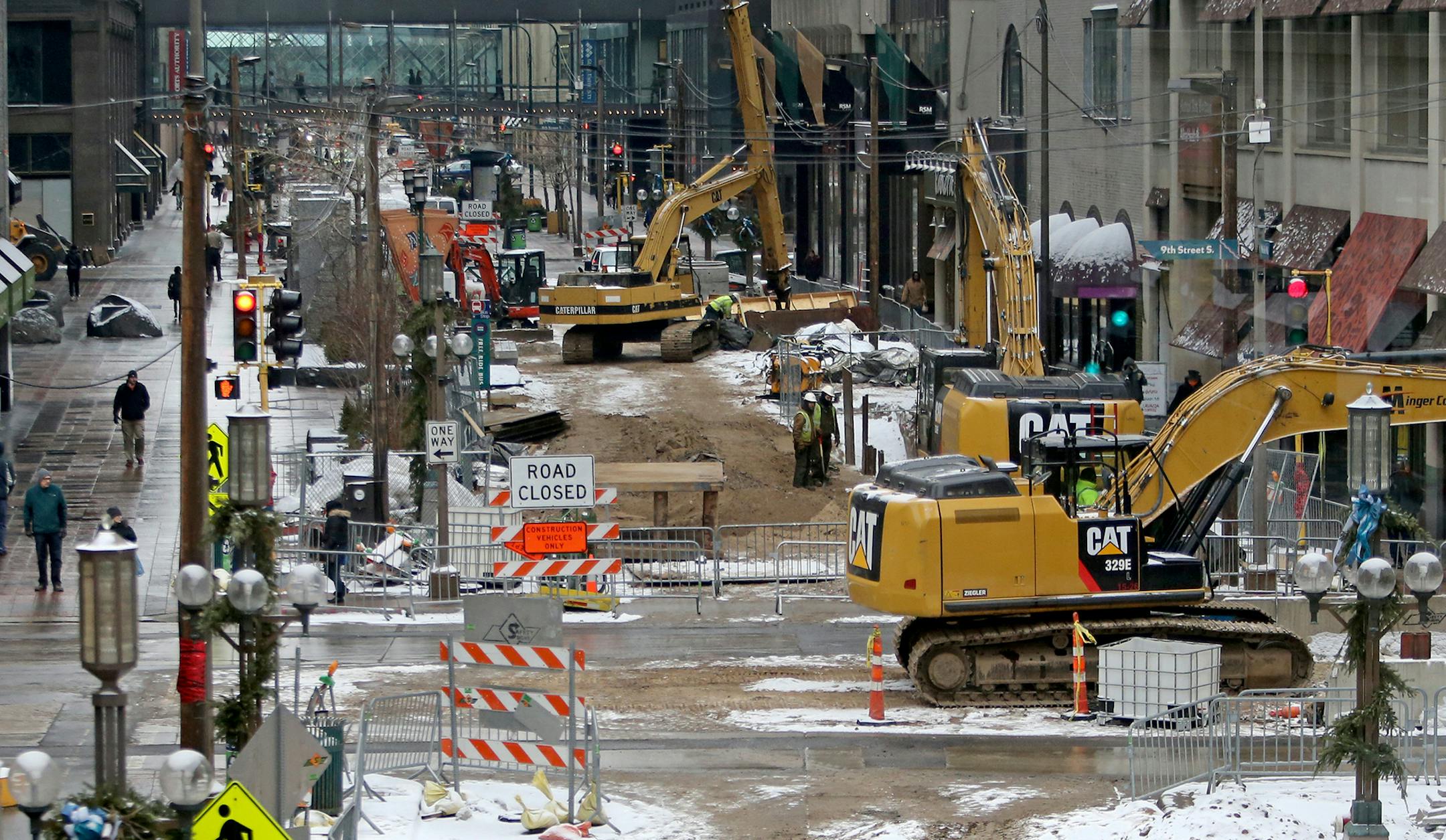As seen from a skyway near Target, pedestrians make their way down Nicollet Mall, torn up for construction, Wednesday, Jan. 20, 2016.